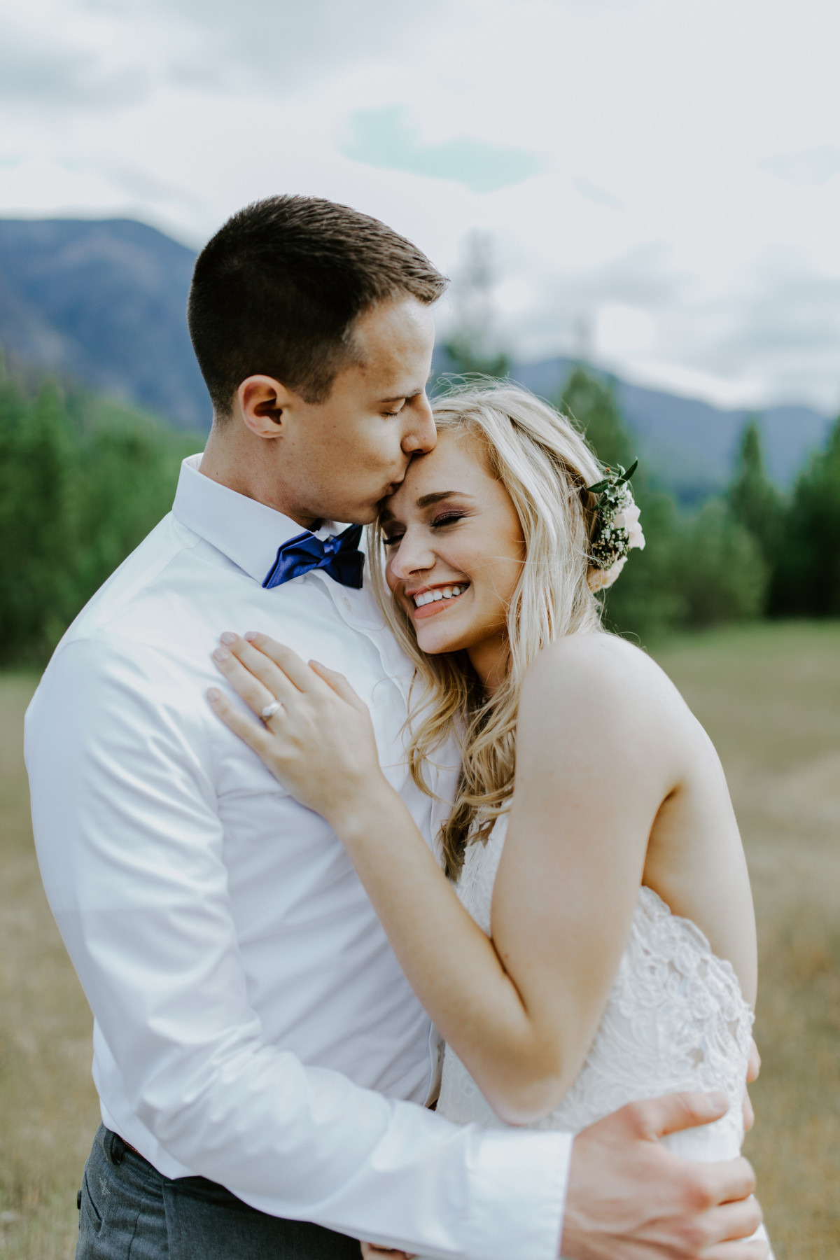 Trevor kisses Harper's forehead at Cascade Locks, Oregon. Elopement photography in Portland Oregon by Sienna Plus Josh.