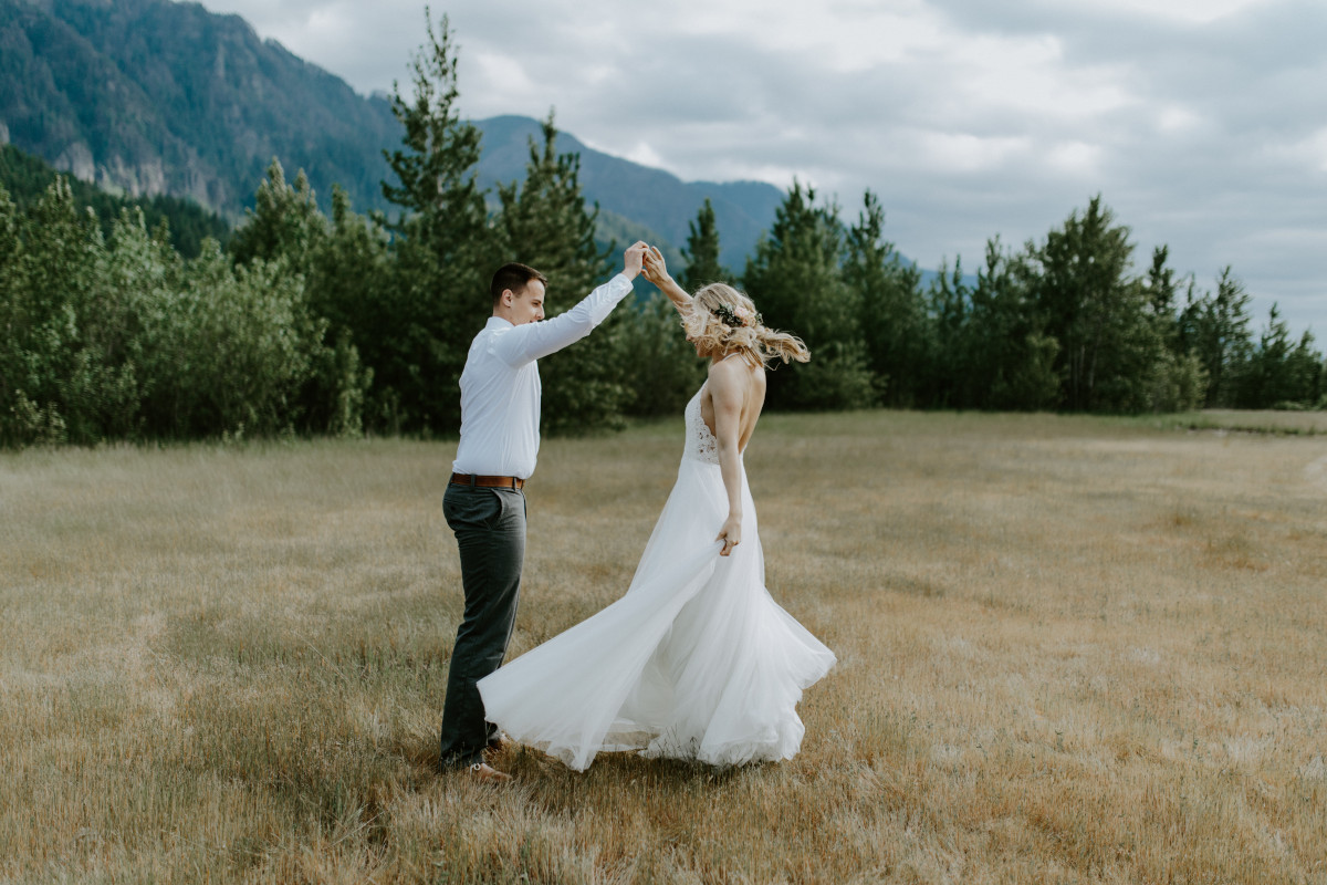 Trevor spins Harper at Cascade Locks in Oregon during their Adventure. Elopement photography in Portland Oregon by Sienna Plus Josh.