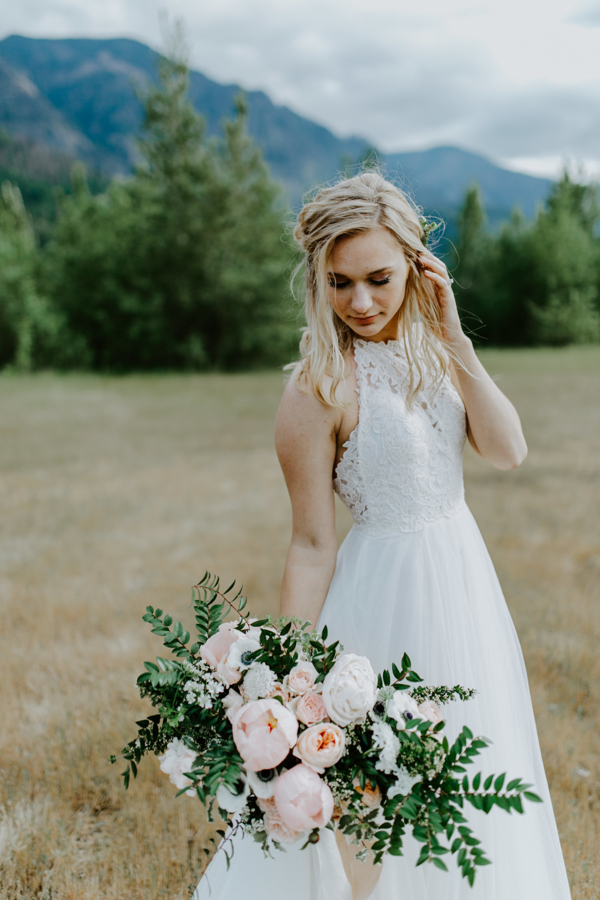 Harper stands alone at Cascade Locks, Oregon during their Oregon Adventure. Elopement photography in Portland Oregon by Sienna Plus Josh.