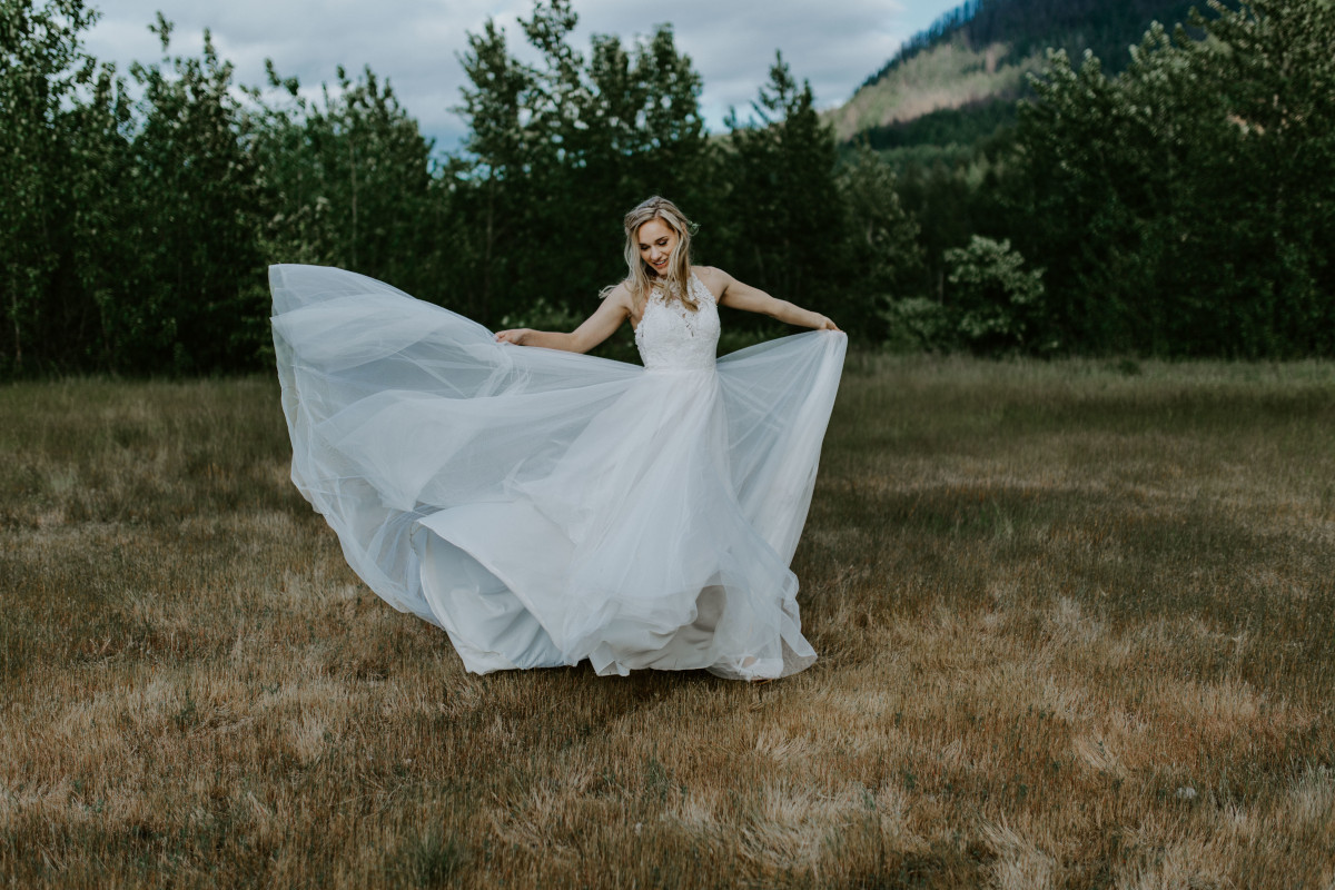 Harper twirls her dress at the Columbia Gorge, Oregon. Elopement photography in Portland Oregon by Sienna Plus Josh.