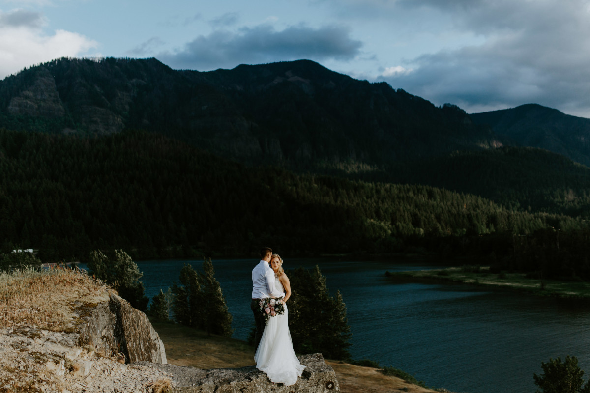 Harper and Trevor stand near the cliffs at Cascade Locks at the Columbia Gorge, Oregon. Elopement photography in Portland Oregon by Sienna Plus Josh.