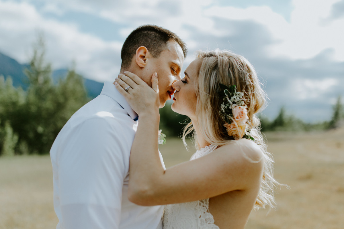 Harper and Trevor go in for a kiss at Cascade Locks in Oregon. Elopement photography in Portland Oregon by Sienna Plus Josh.