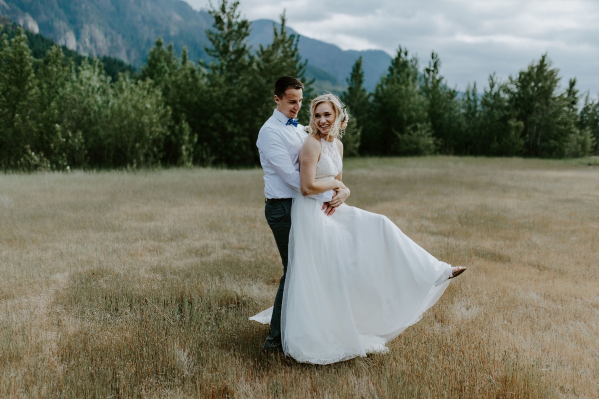 Harper and Trevor hugging at the Columbia River Gorge, Oregon. Elopement photography in Portland Oregon by Sienna Plus Josh.