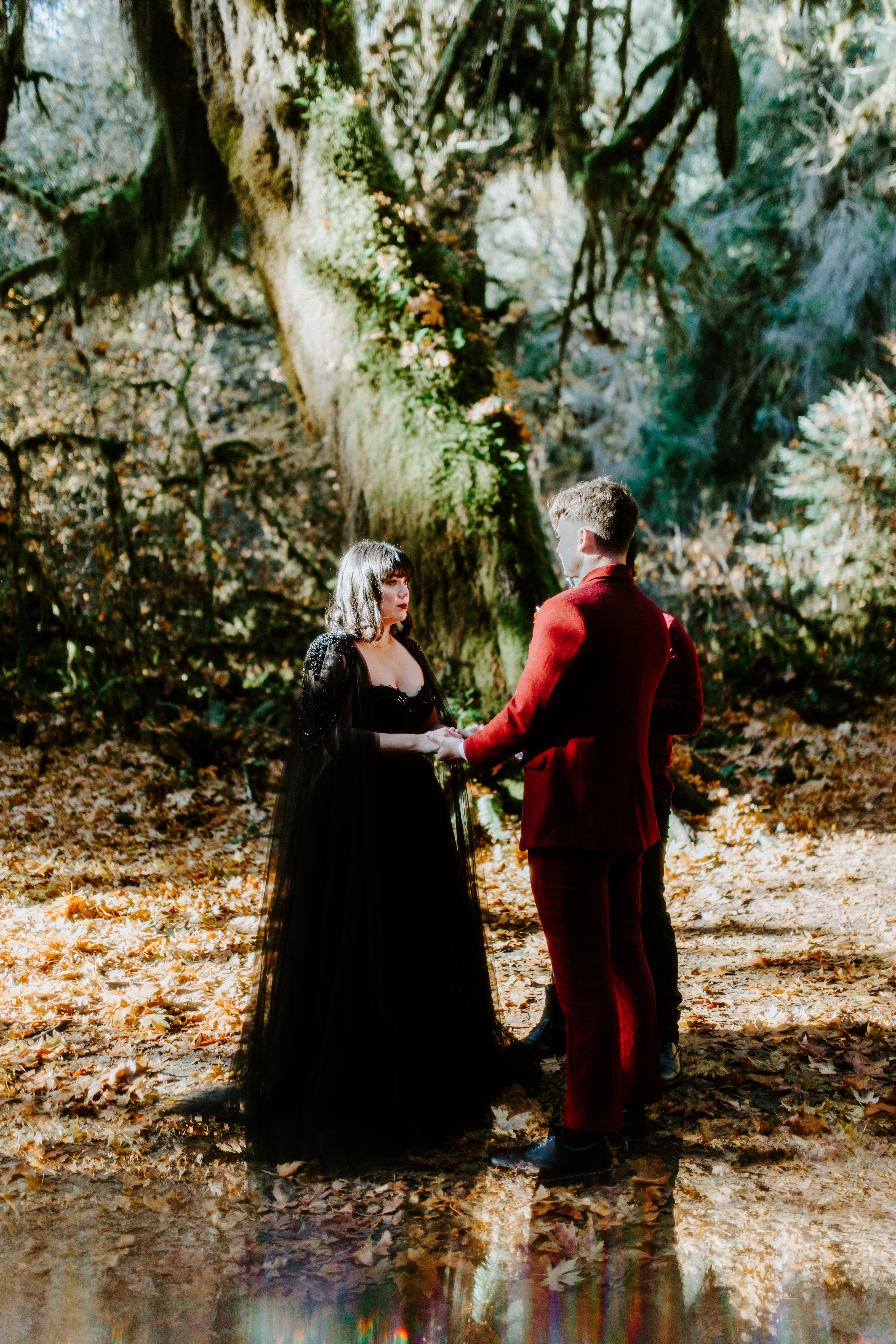 Bethany and Brett stand together during their elopement in the Hoh Rainforest.