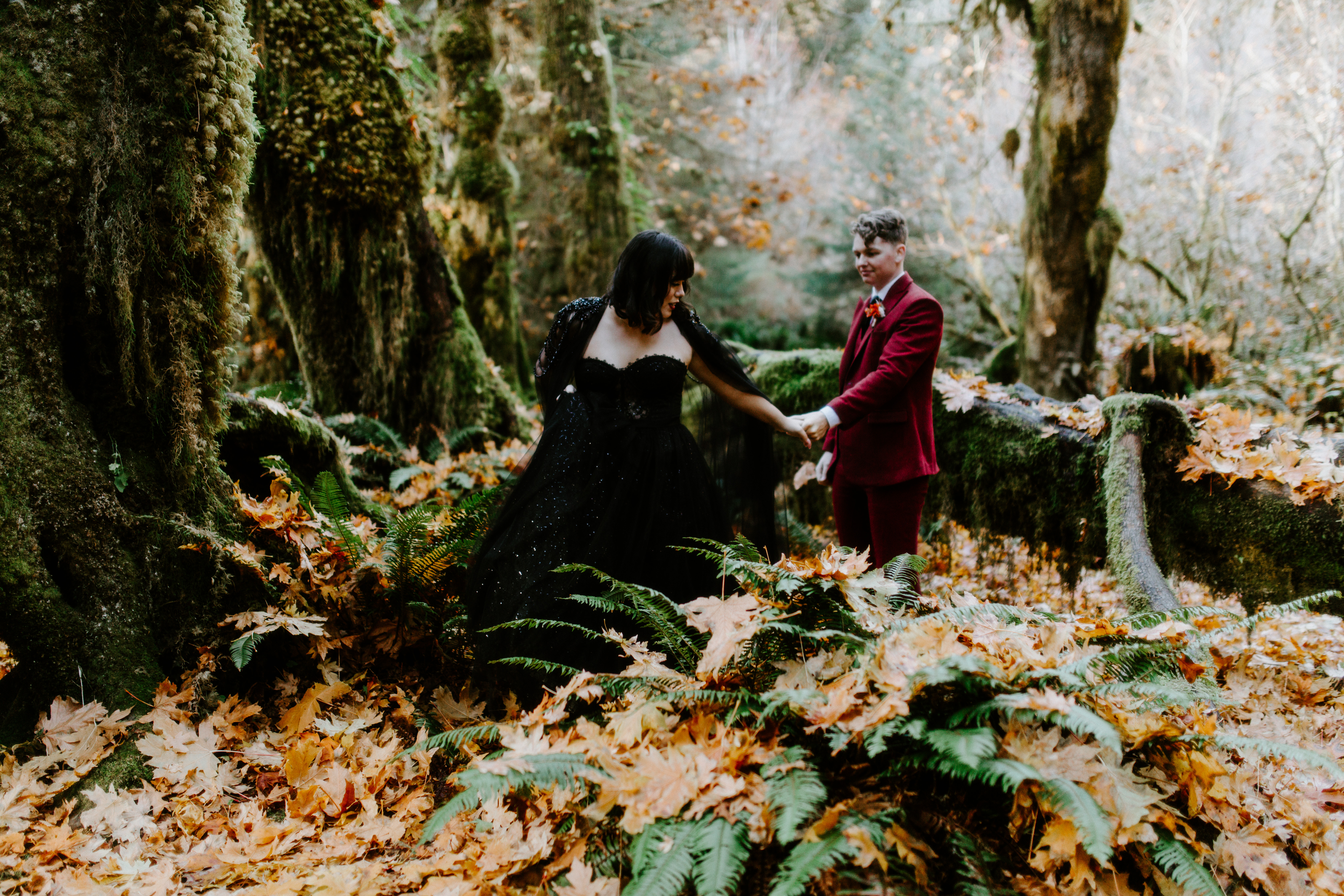 Bethany leads Brett through the woods of Hoh Rainforest.