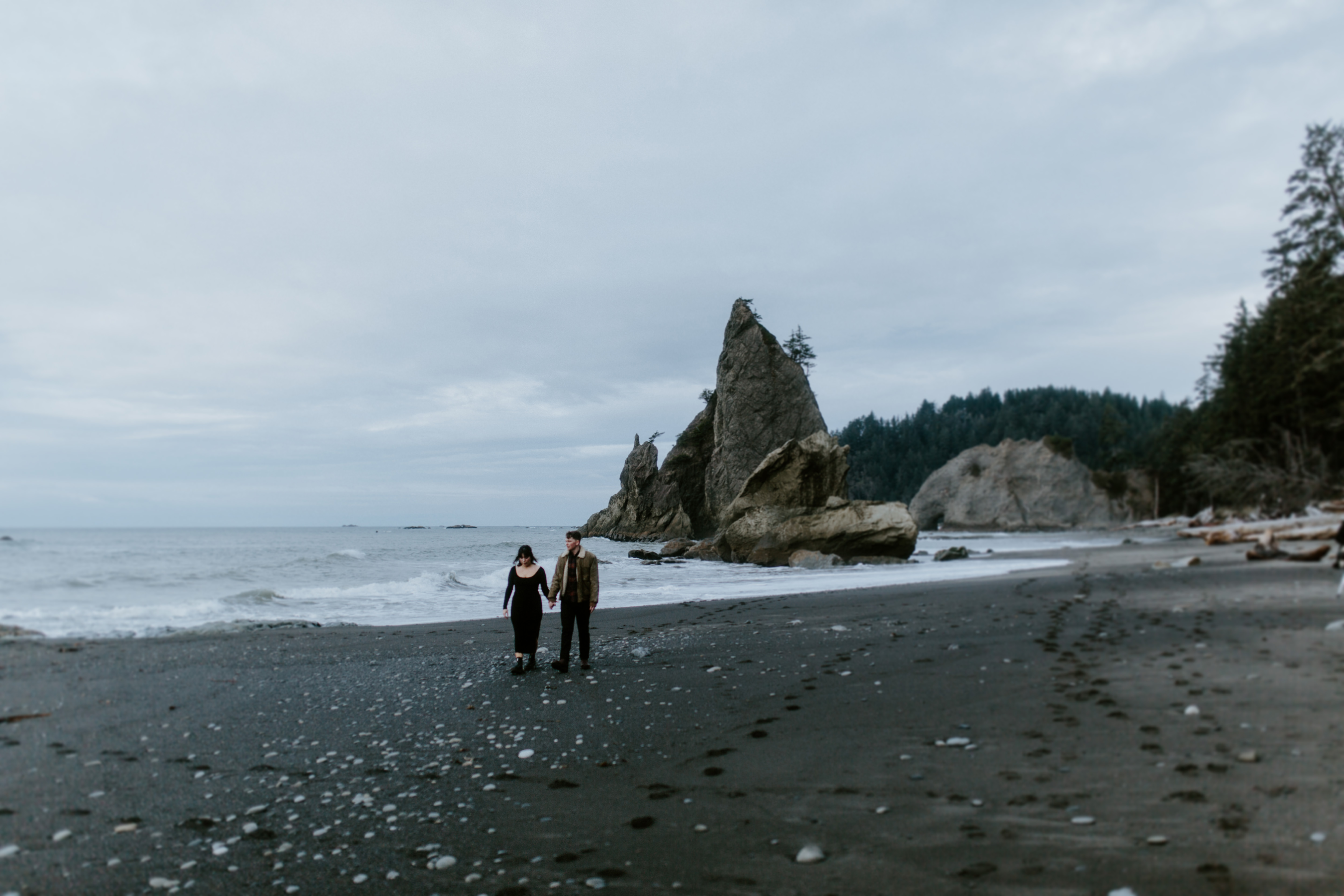 Bethany and Brett take a stroll on the sand of Rialto Beach, Washington.