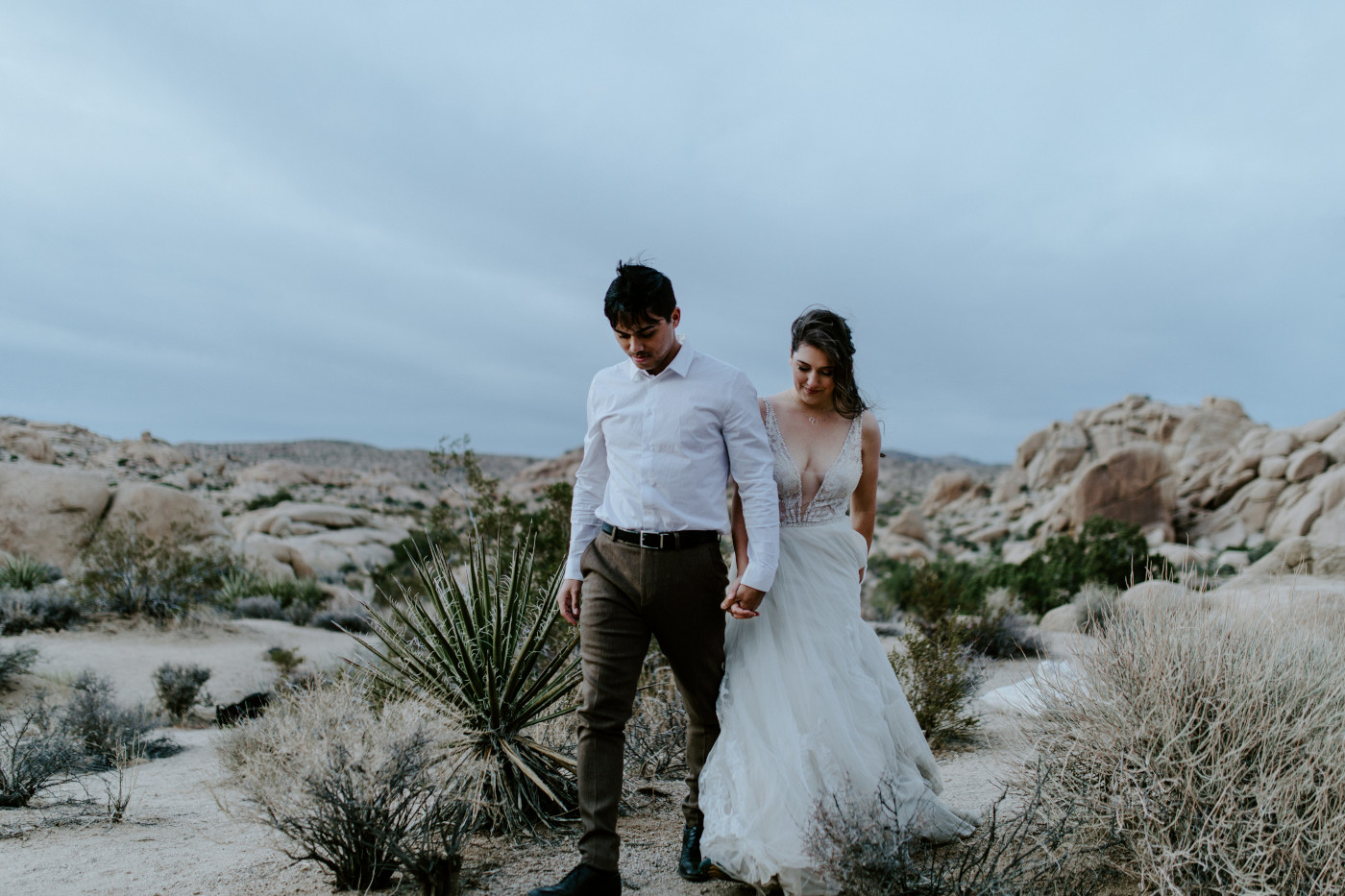 Shelby and Zack walk side by side in Joshua Tree National Park.