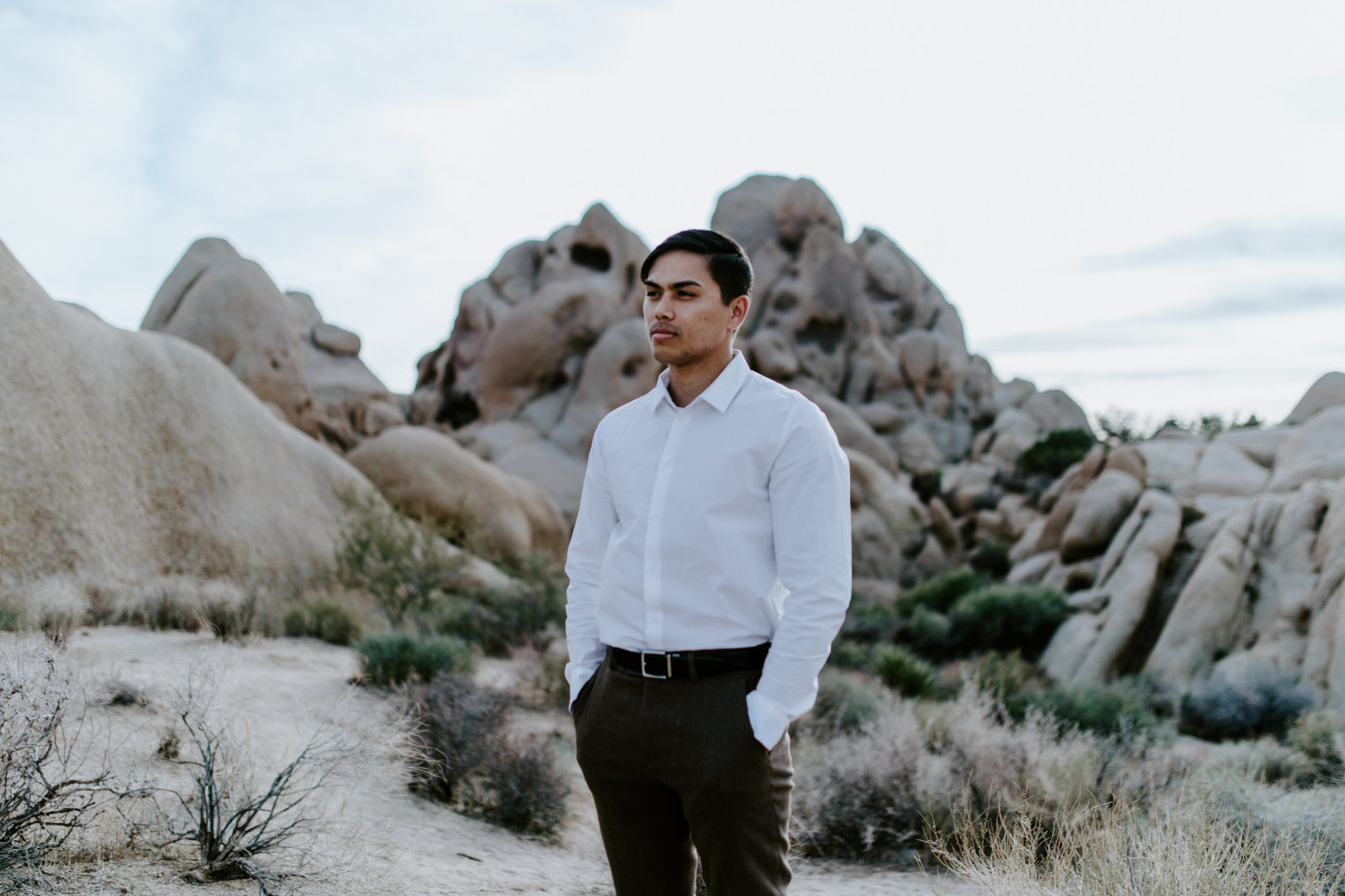 Zack stands in Joshua Tree National Park while he waits for Shelby.