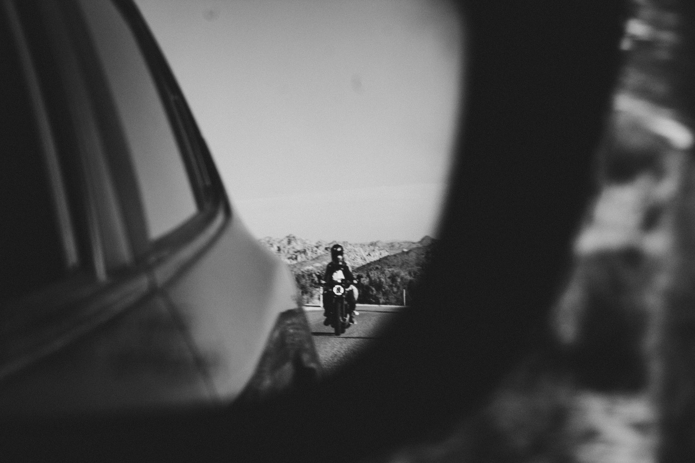 Becca and Madison drive in the Joshua Tree desert on their motorcycle.