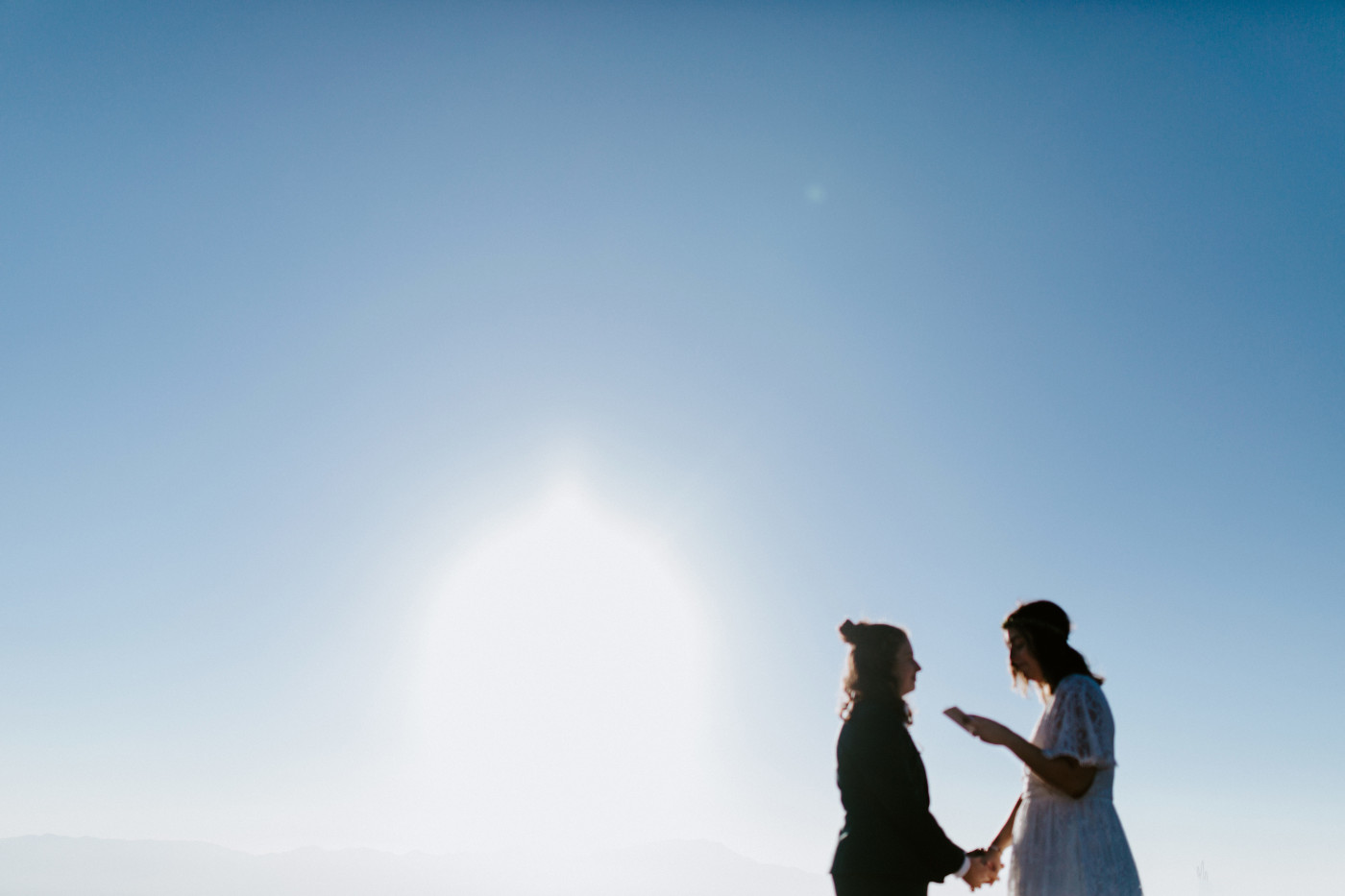 Becca and Madison reading their elopement vows.