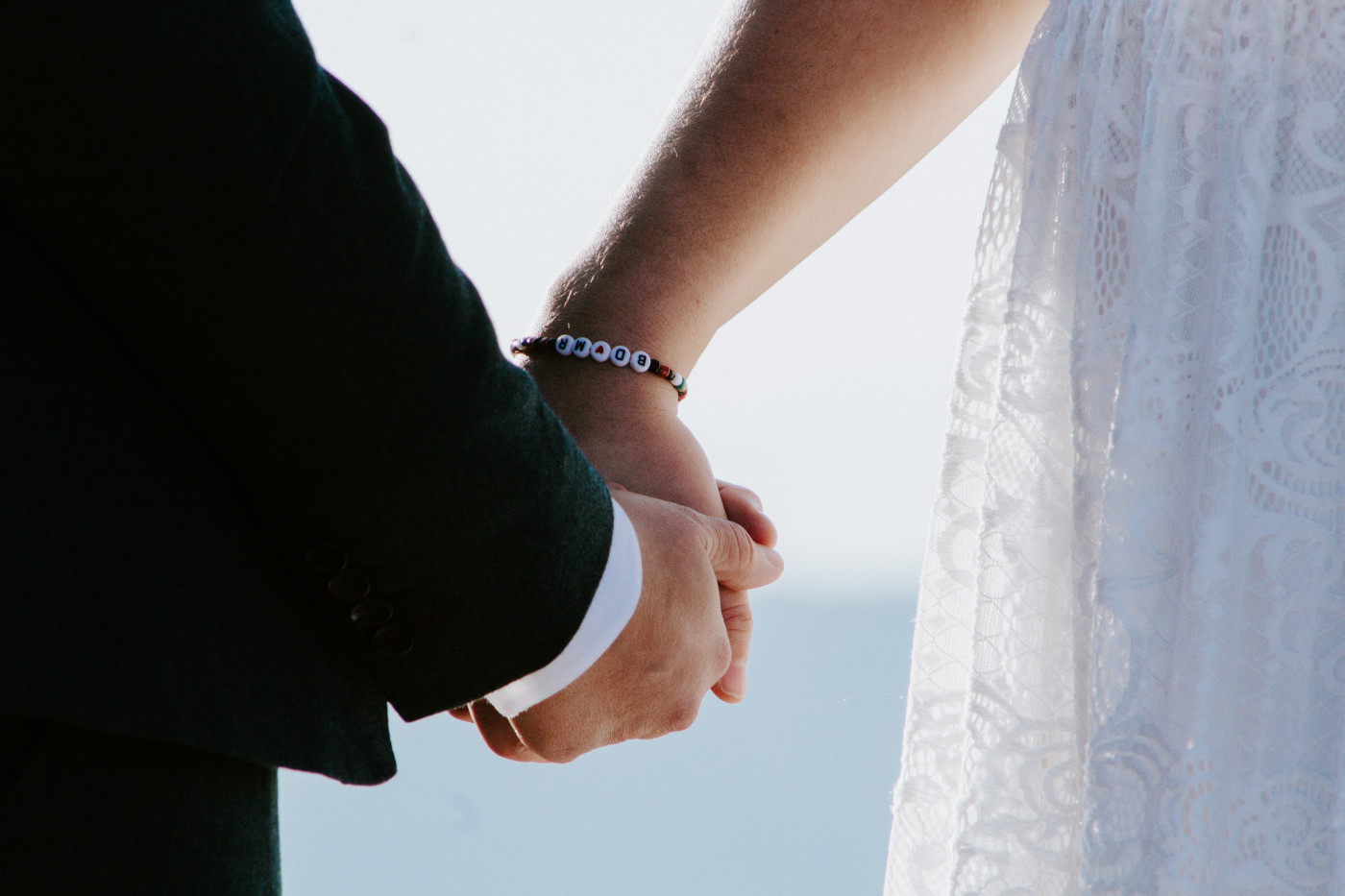 Becca and Madison hold hands.