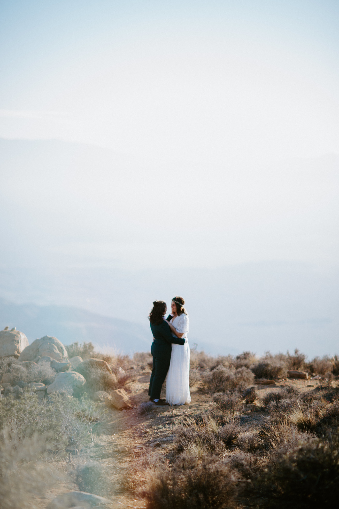 Madison and Becca stand together in the Joshua Tree National Park desert.