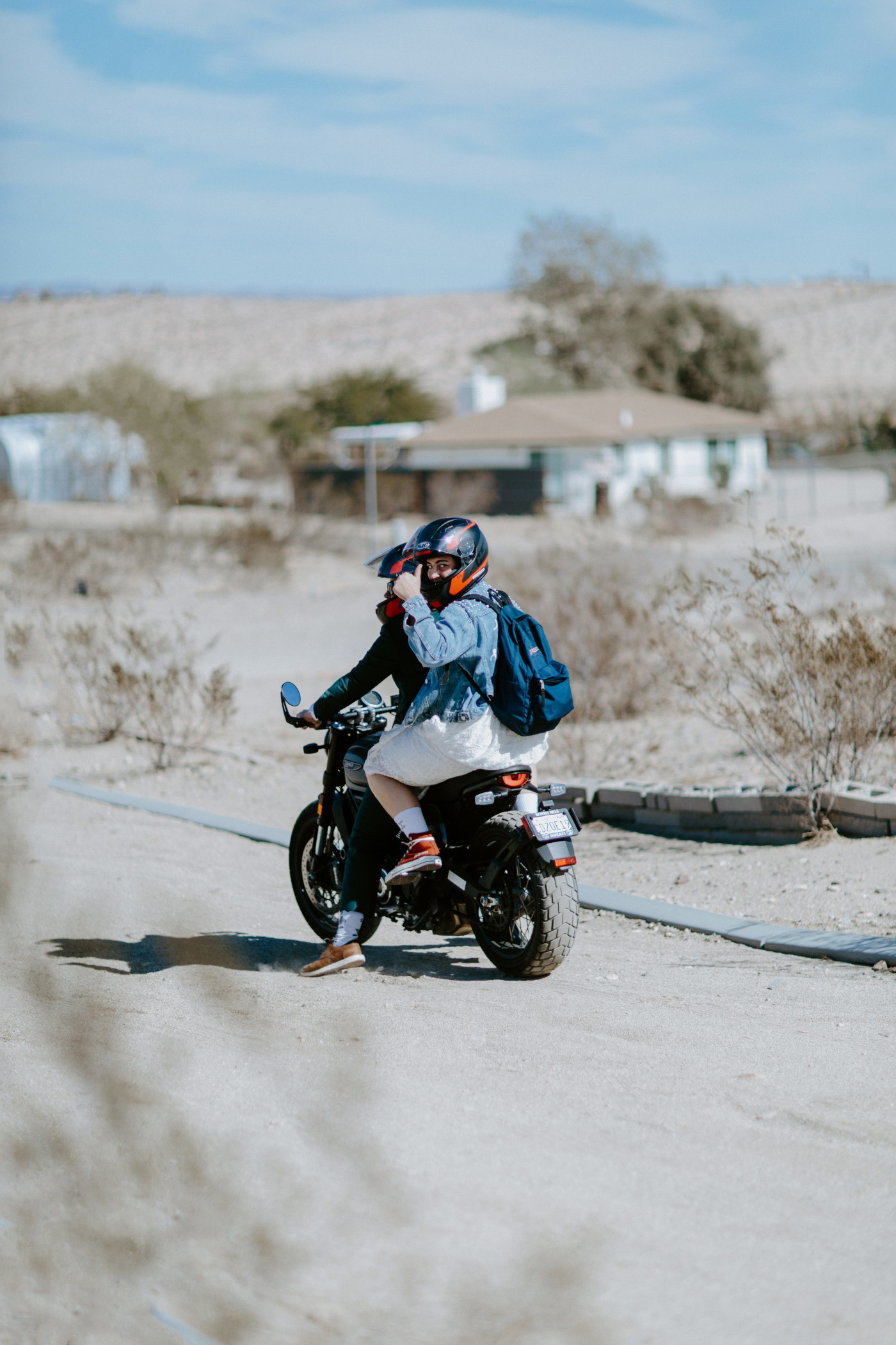 Becca and Madison ride off on motorcycles.