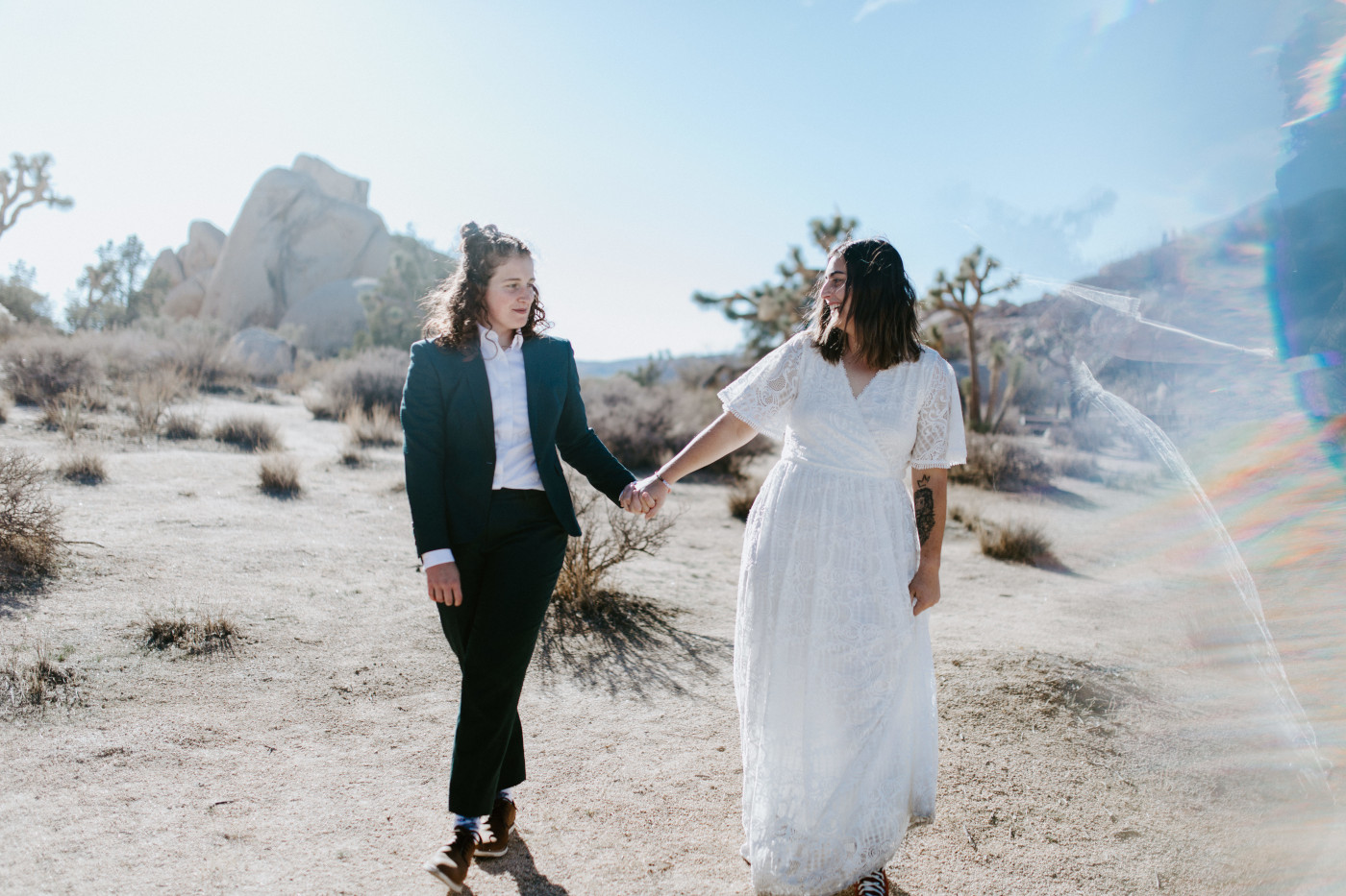 Becca and Madison walk through the desert.