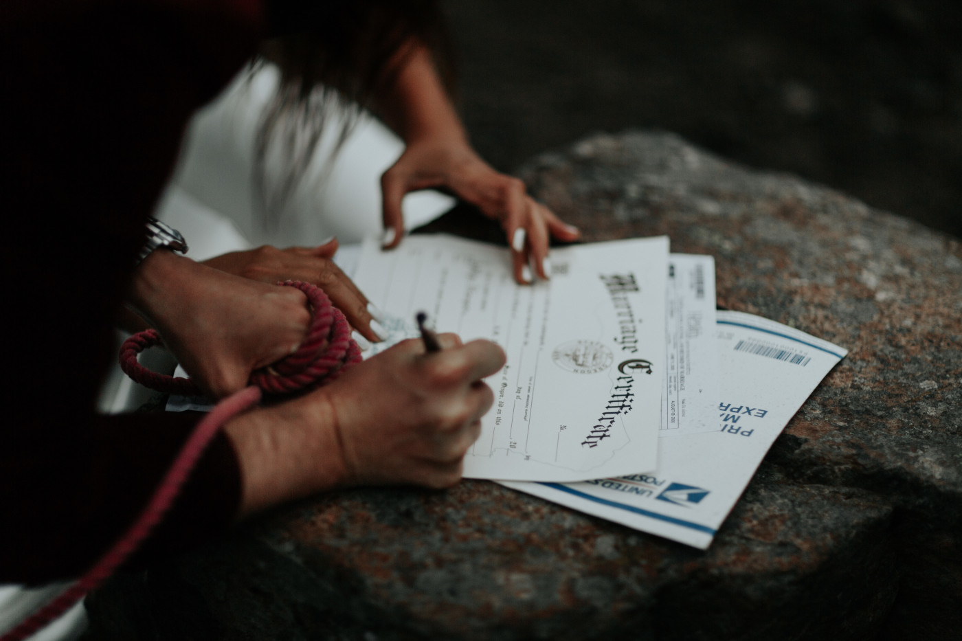 Katelyn and Murray sign their marriage license. Elopement wedding photography at Mount Hood by Sienna Plus Josh.