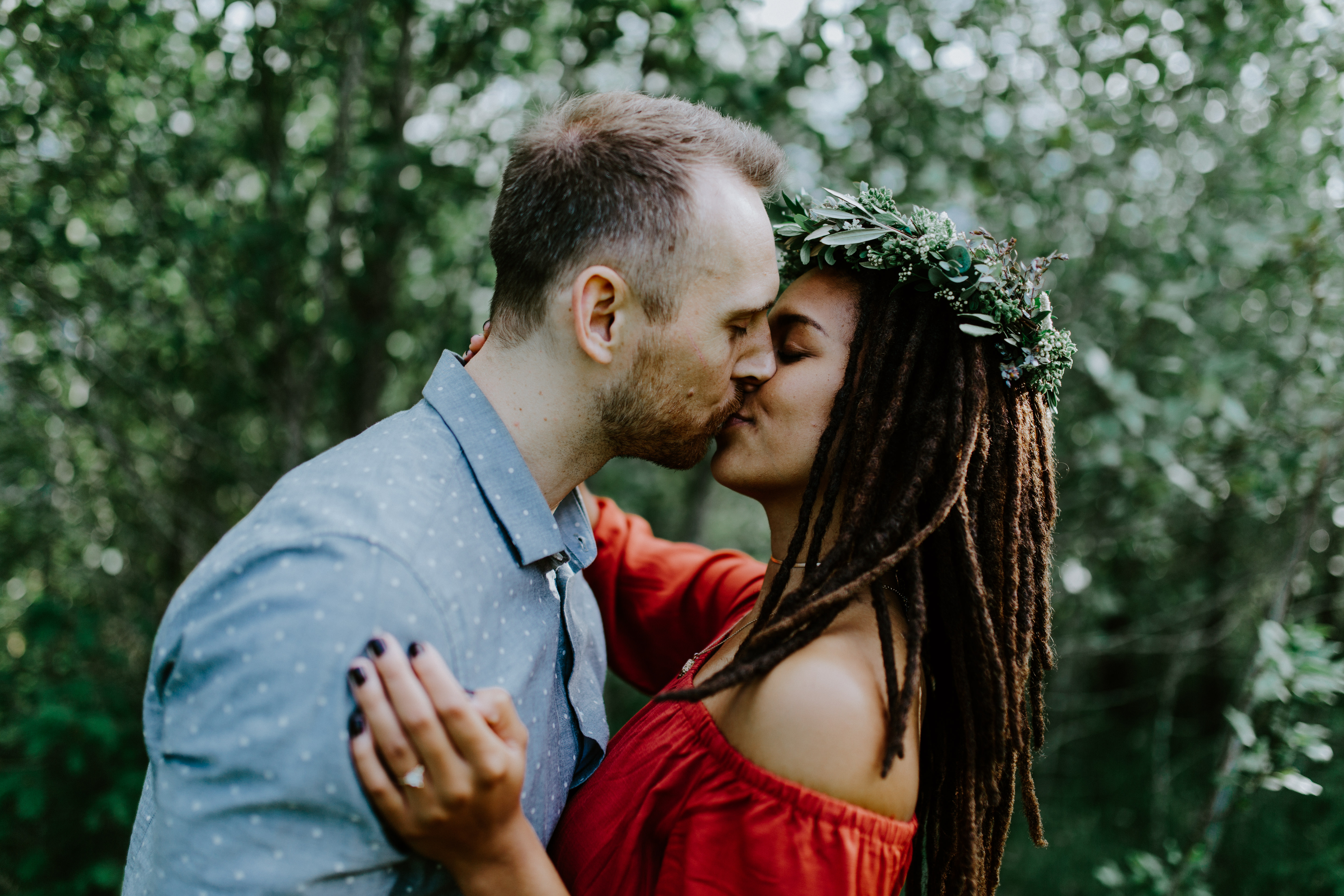 Kayloni and Garrett kiss at Cascade Locks, Oregon during her Oregon coast elopement. Engagement photography in Portland Oregon by Sienna Plus Josh.