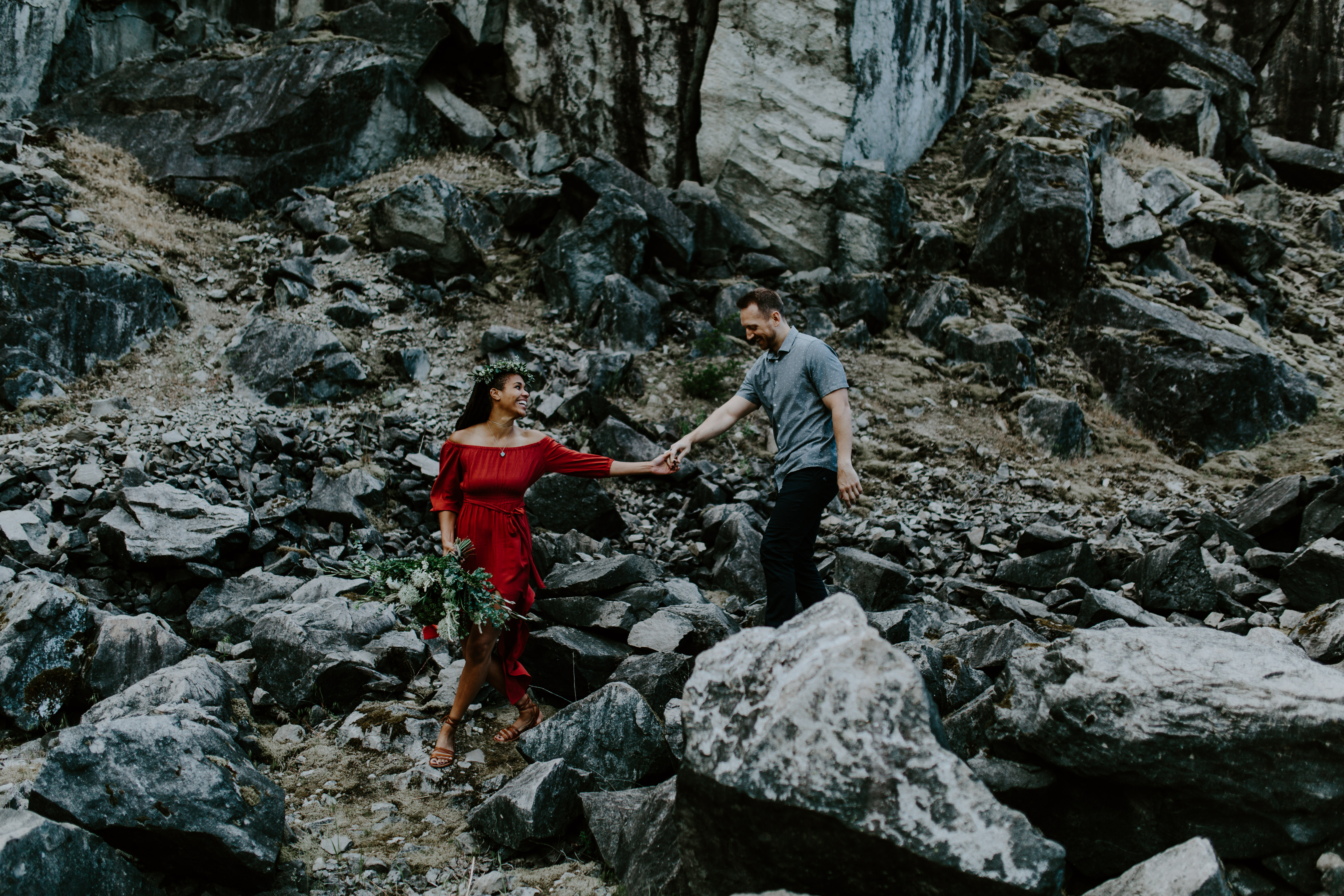 Kayloni leads Garrett down the rocks of Cascade Locks, Oregon. Engagement photography in Portland Oregon by Sienna Plus Josh.