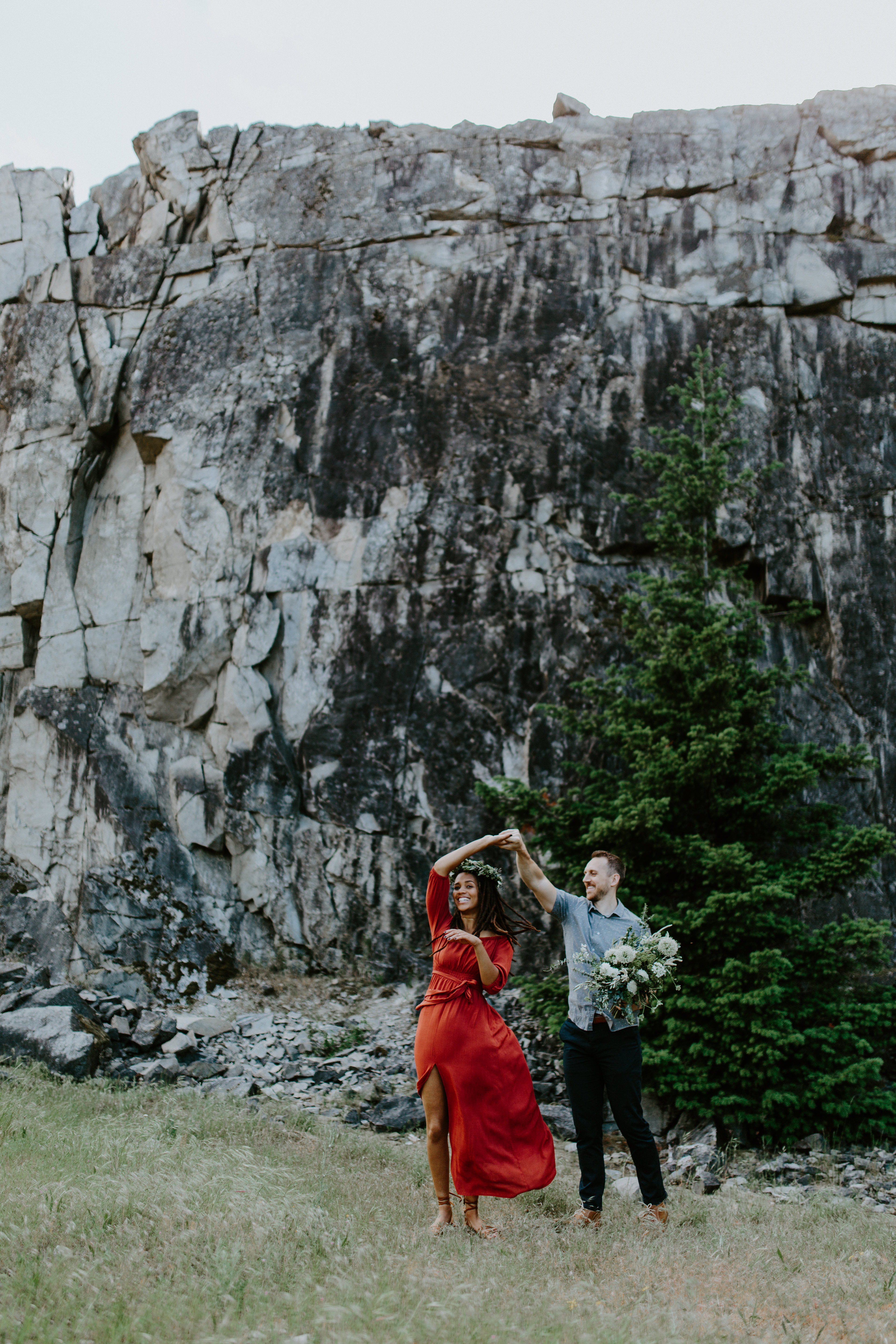 Garrett twirls Kayloni as they dance at Cascade Locks, Oregon. Engagement photography in Portland Oregon by Sienna Plus Josh.