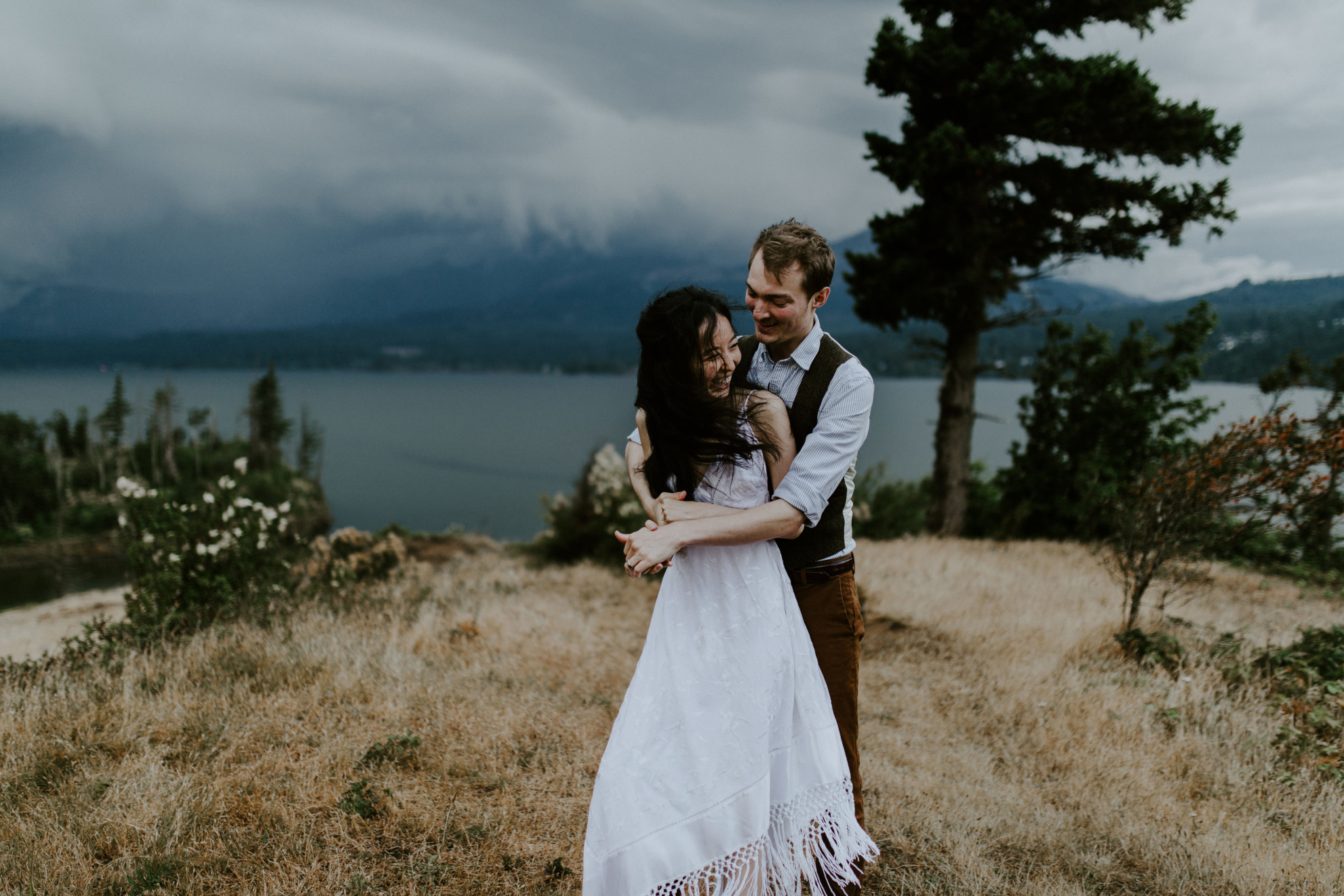 Kimberlie and Jacob hug at Cascade Locks, OR. Elopement wedding photography at Cascade Locks by Sienna Plus Josh.