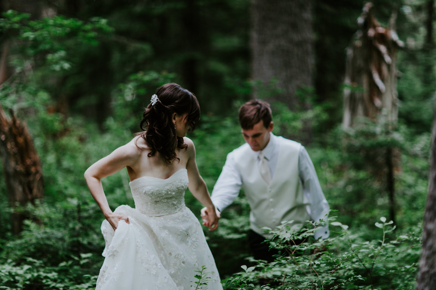 Moira guides Ryan along the trail to Mount Hood. Adventure elopement wedding shoot by Sienna Plus Josh.