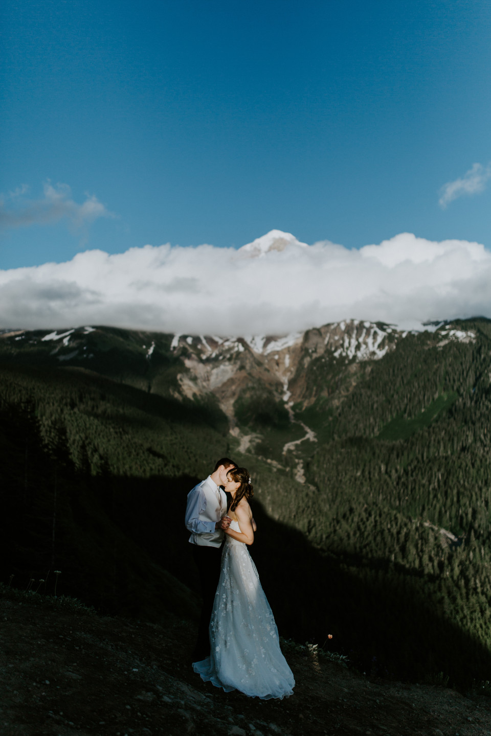 Ryan and Moira move in for a kiss in front of Mount Hood. Adventure elopement wedding shoot by Sienna Plus Josh.