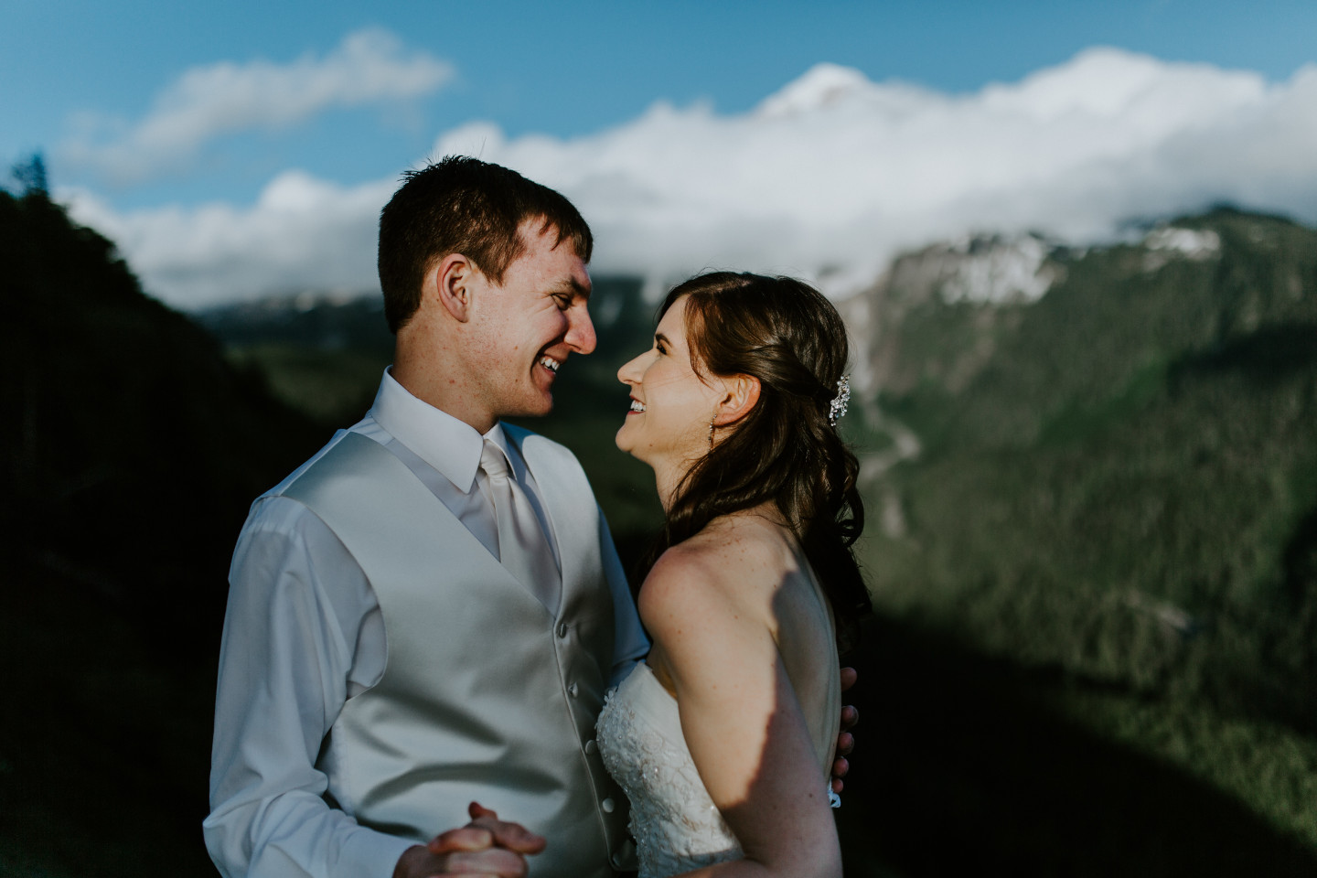 Moira and Ryans smile at each other near at Mount Hood. Adventure elopement wedding shoot by Sienna Plus Josh.