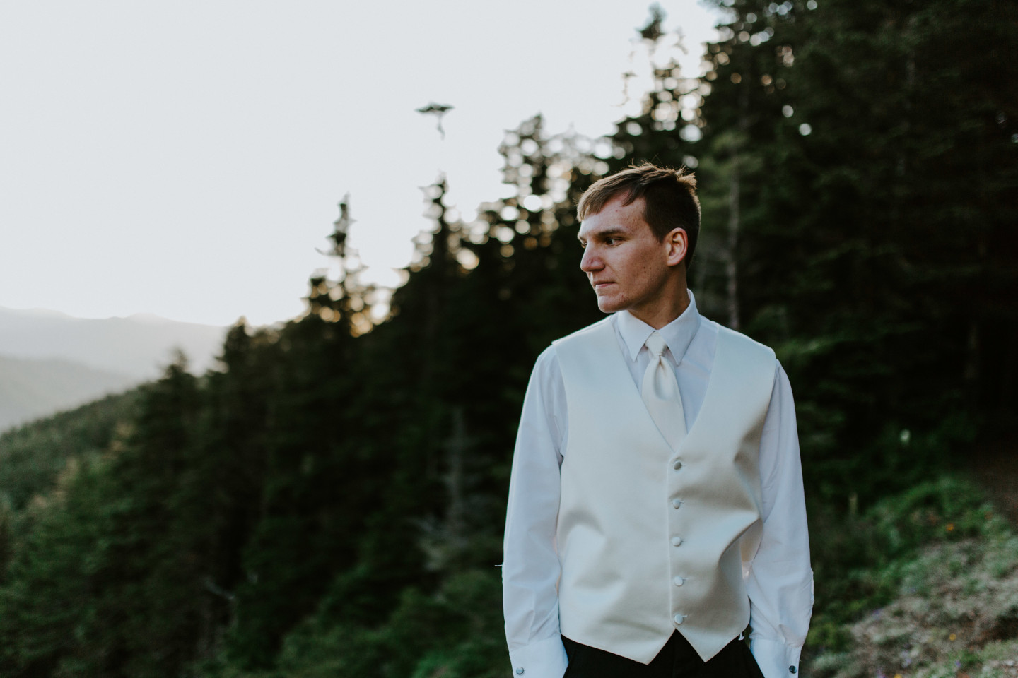 Ryan stands alone near the view of Mount Hood. Adventure elopement wedding shoot by Sienna Plus Josh.