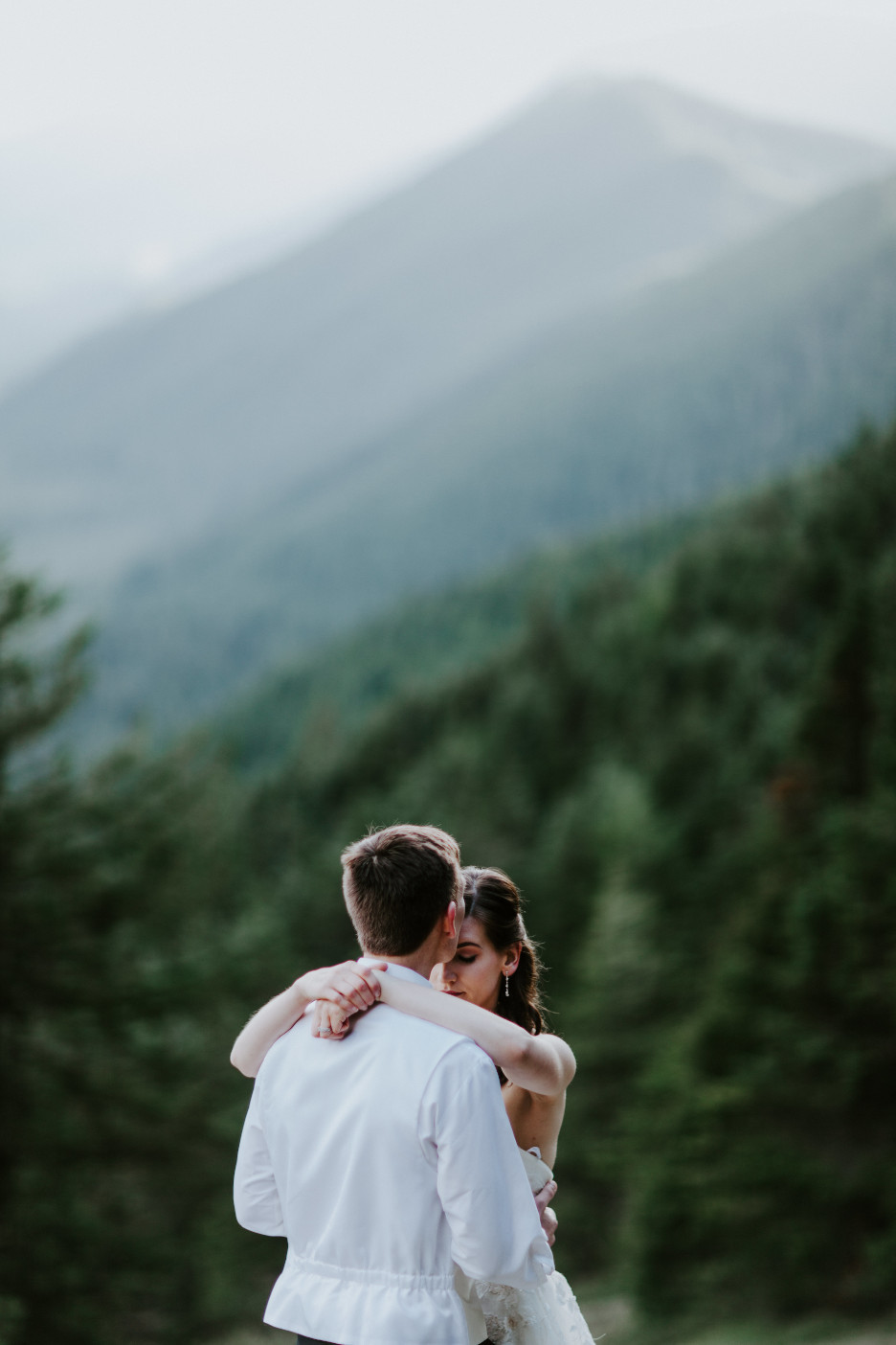 Ryan kisses Moira's forehead. Adventure elopement wedding shoot by Sienna Plus Josh.