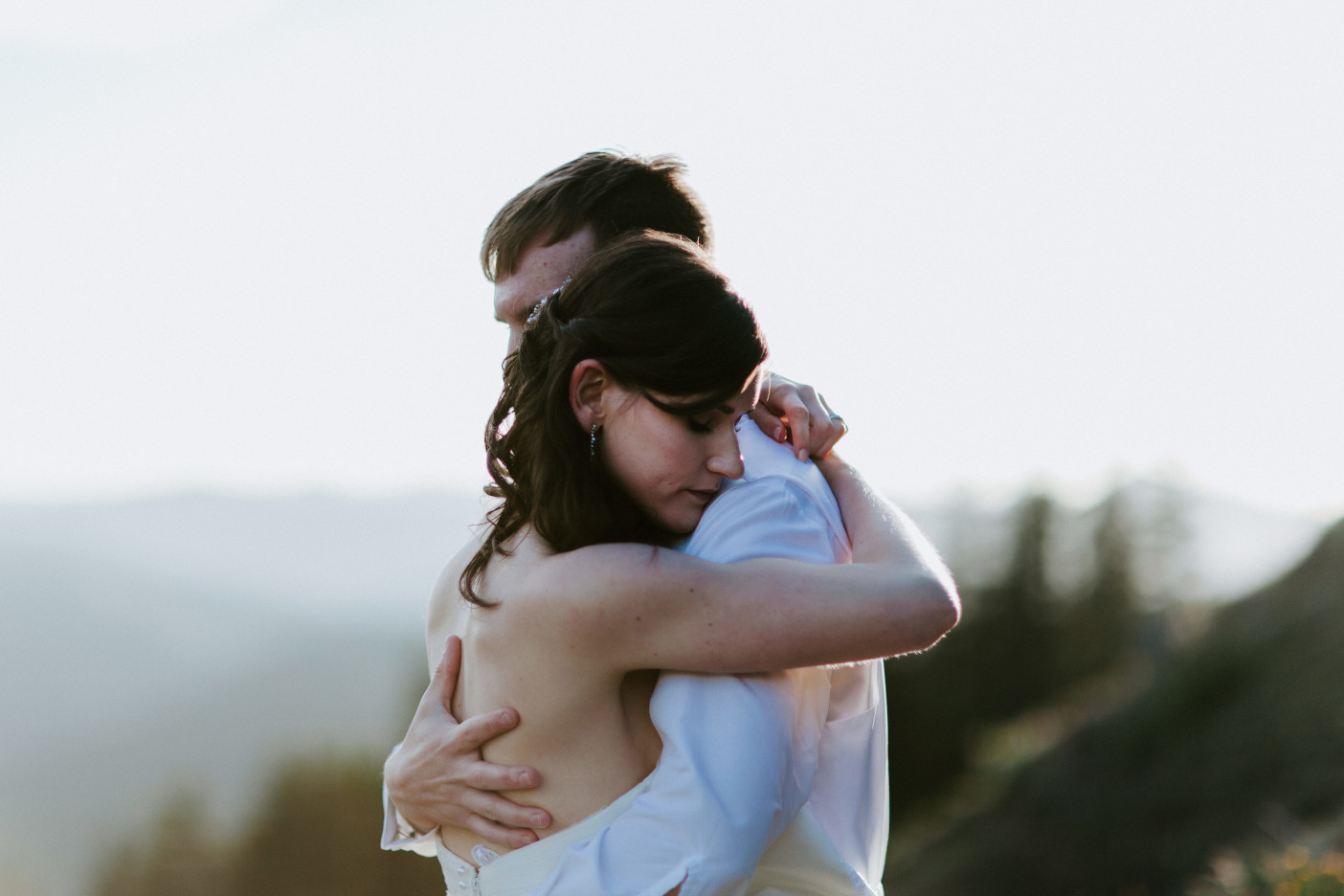 Ryan and Moira hug on the trail near Mount Hood. Adventure elopement wedding shoot by Sienna Plus Josh.