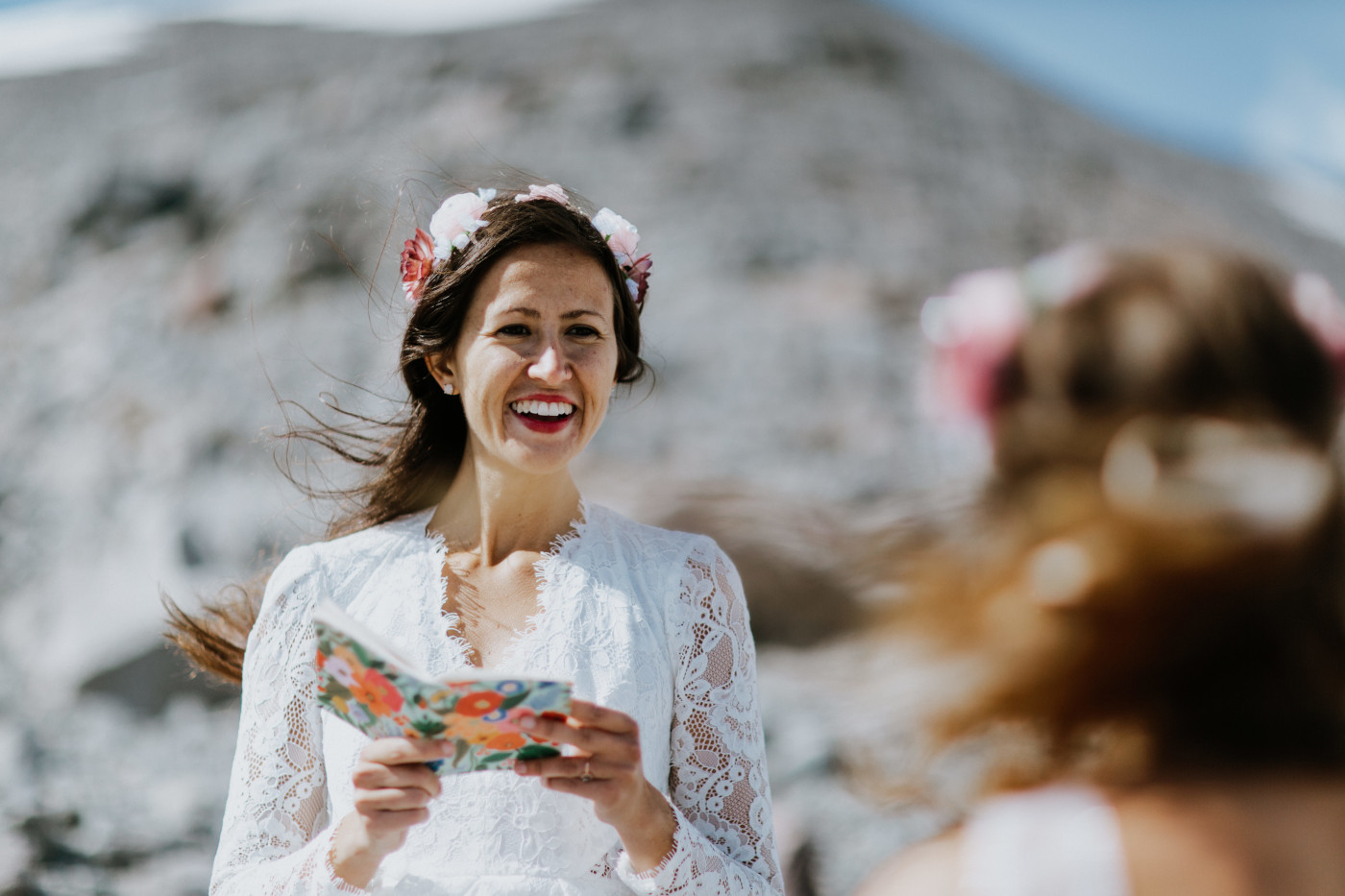 Margaux and Heather reading vows during their ceremony. Elopement photography at Mount Hood by Sienna Plus Josh.