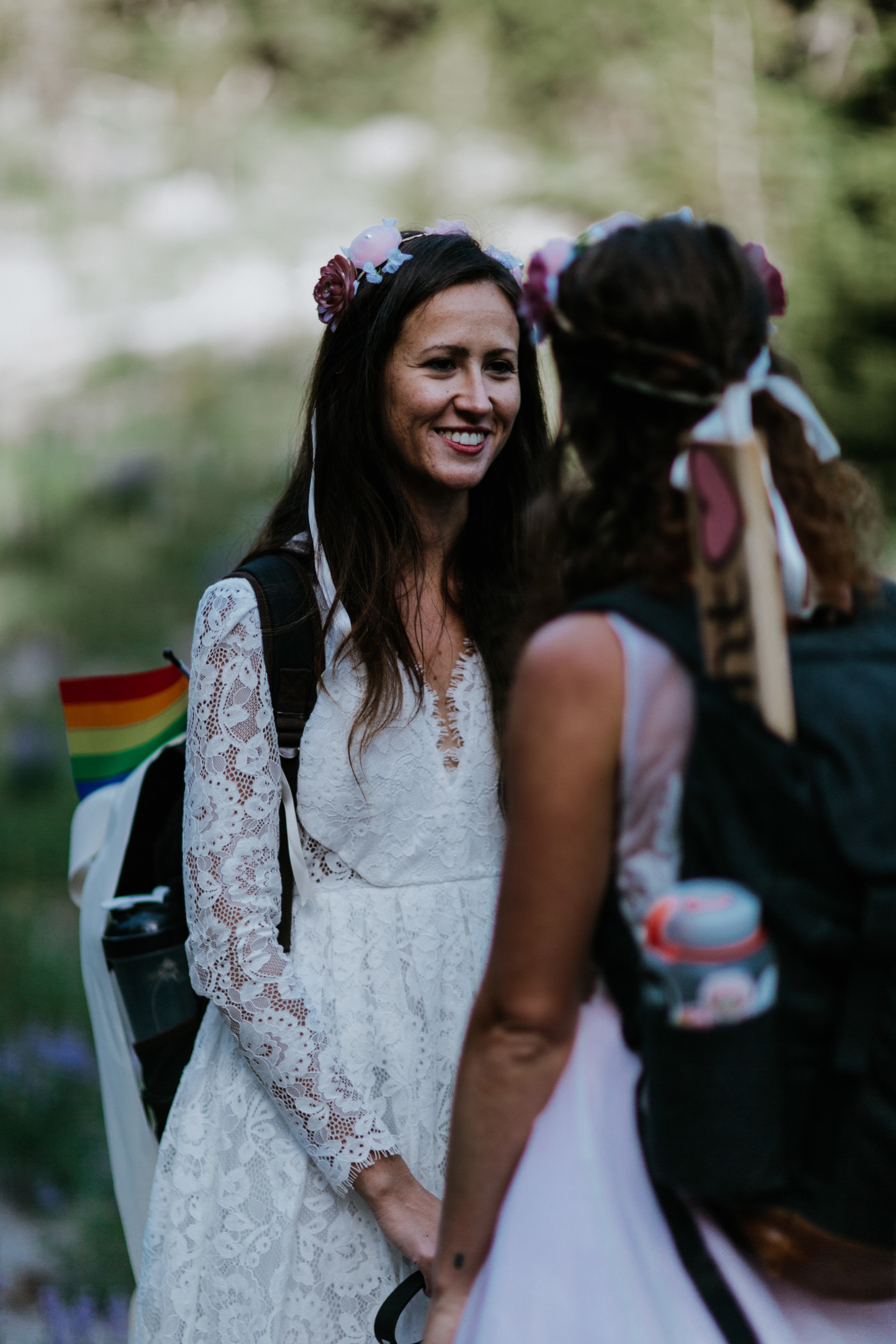 Margaux and Heather standing face to face at the early portion of the trail. Elopement photography at Mount Hood by Sienna Plus Josh.