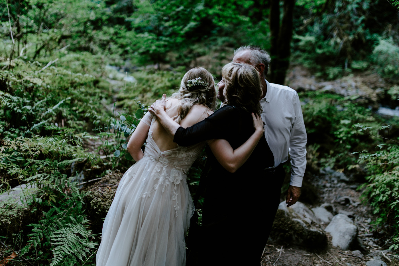 Kylie hugs her parents.