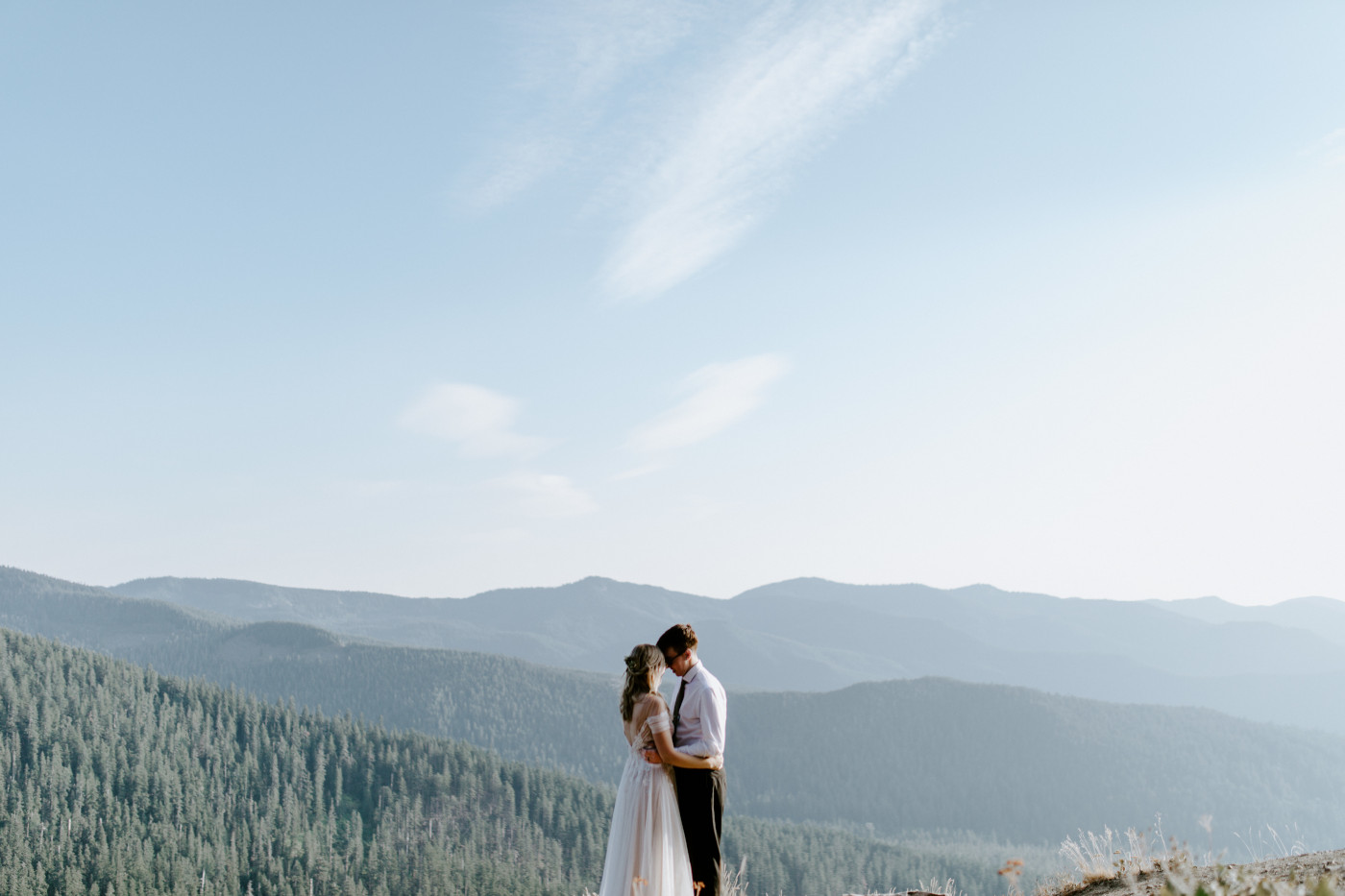 Kylie and Corey with the expansive views of Mount Hood National Forest behind them.