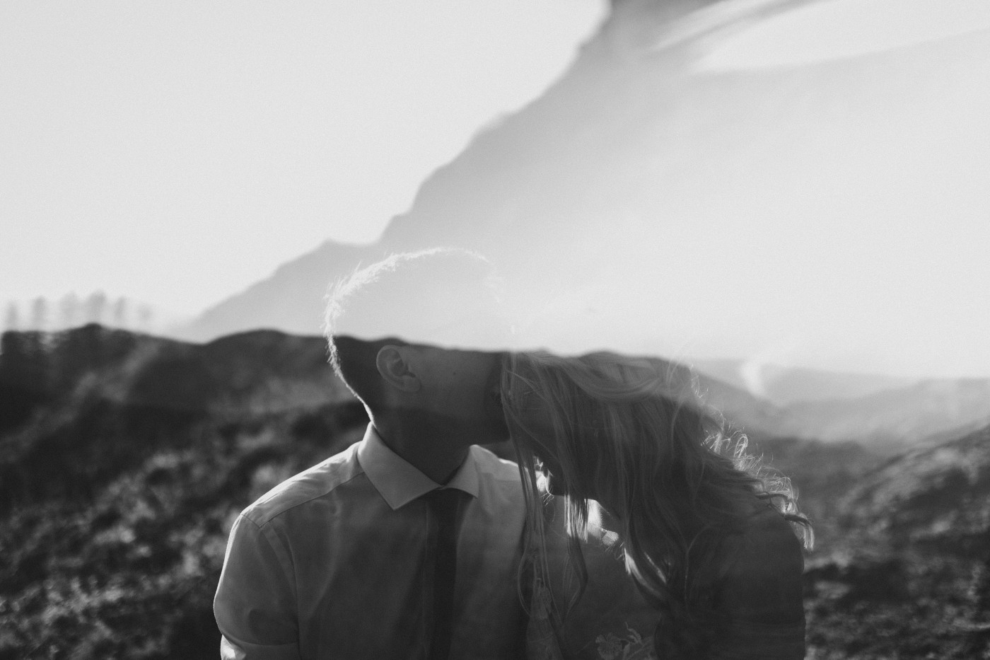 A black and white picture of Corey and Kylie kissing.