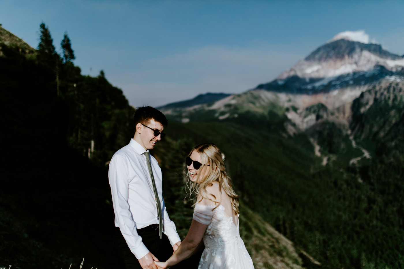 Corey and Kylie laugh with Mount Hood in the background.