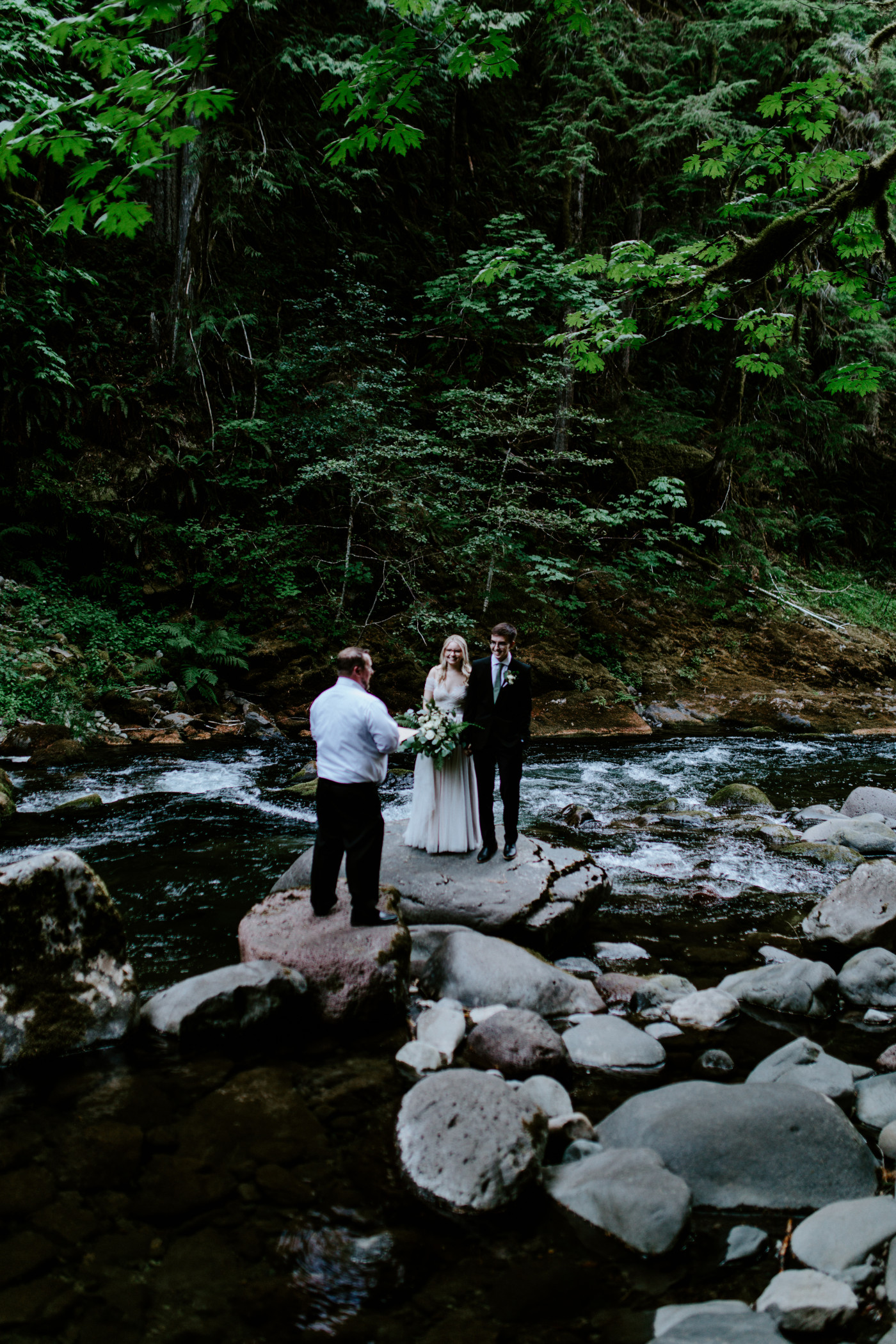 Kylie and Corey stand together during their elopement ceremony.