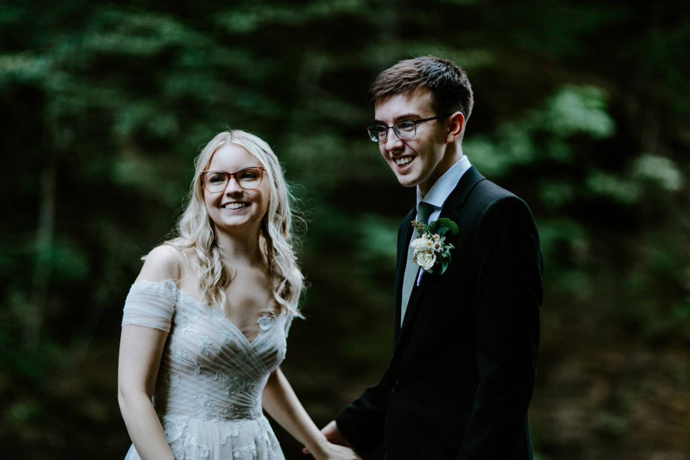 Corey and Kylie listen to their officiant during their elopement ceremony.