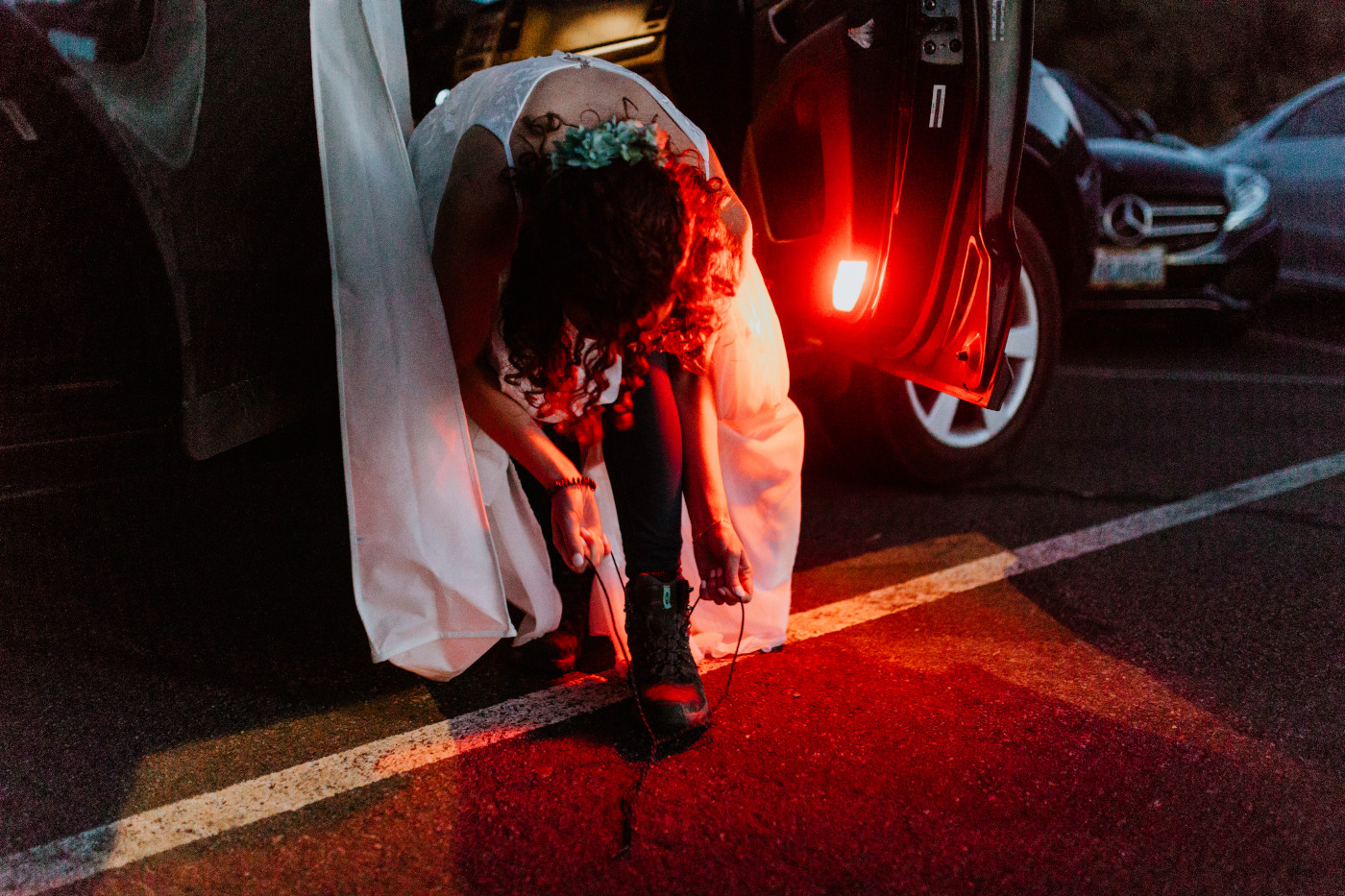 Chad and Tasha get ready at the parking lot. Elopement photography at Mount Rainier by Sienna Plus Josh.