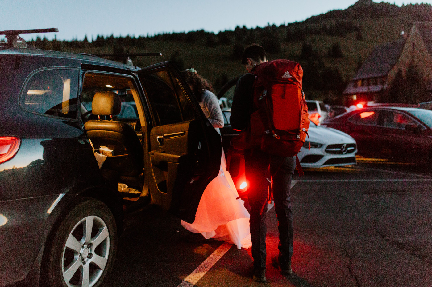 Chad and Tasha get ready at the parking lot. Elopement photography at Mount Rainier by Sienna Plus Josh.