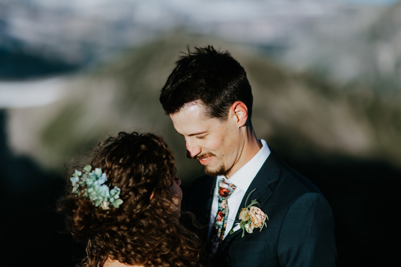 Chad smiles at Tasha. Elopement photography at Mount Rainier by Sienna Plus Josh.