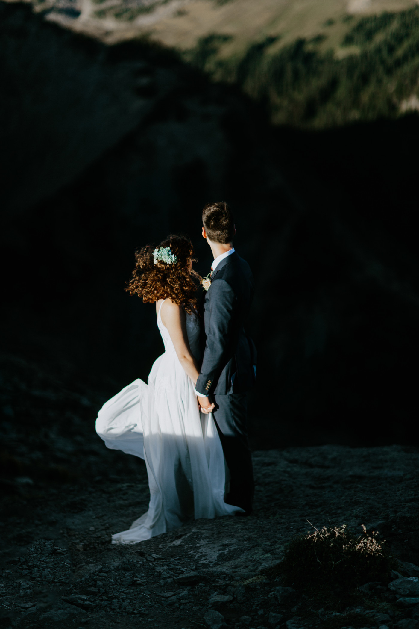 Chad and Tasha stand together to look at the view. Elopement photography at Mount Rainier by Sienna Plus Josh.