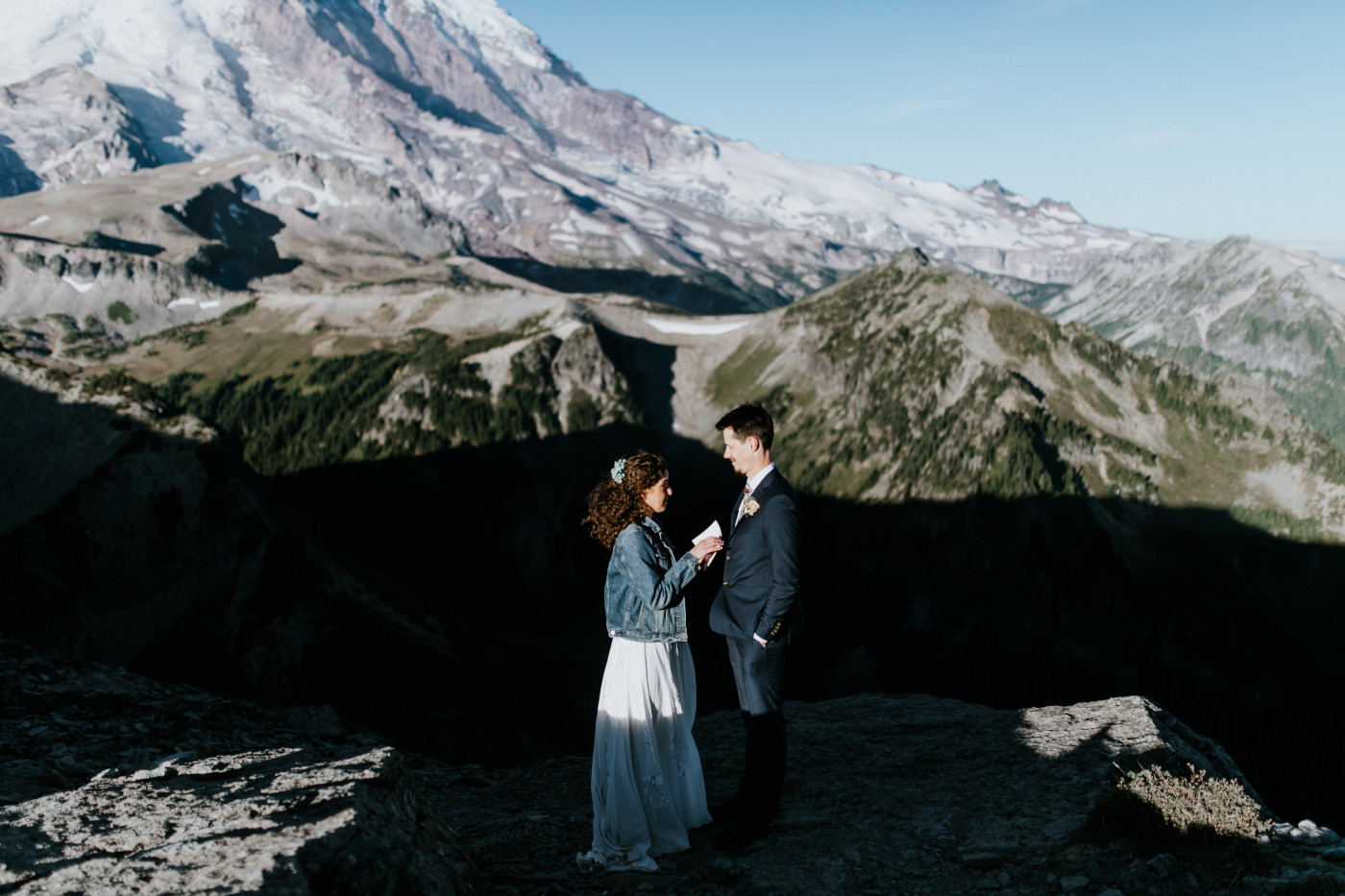 Tasha reads to Chad. Elopement photography at Mount Rainier by Sienna Plus Josh.