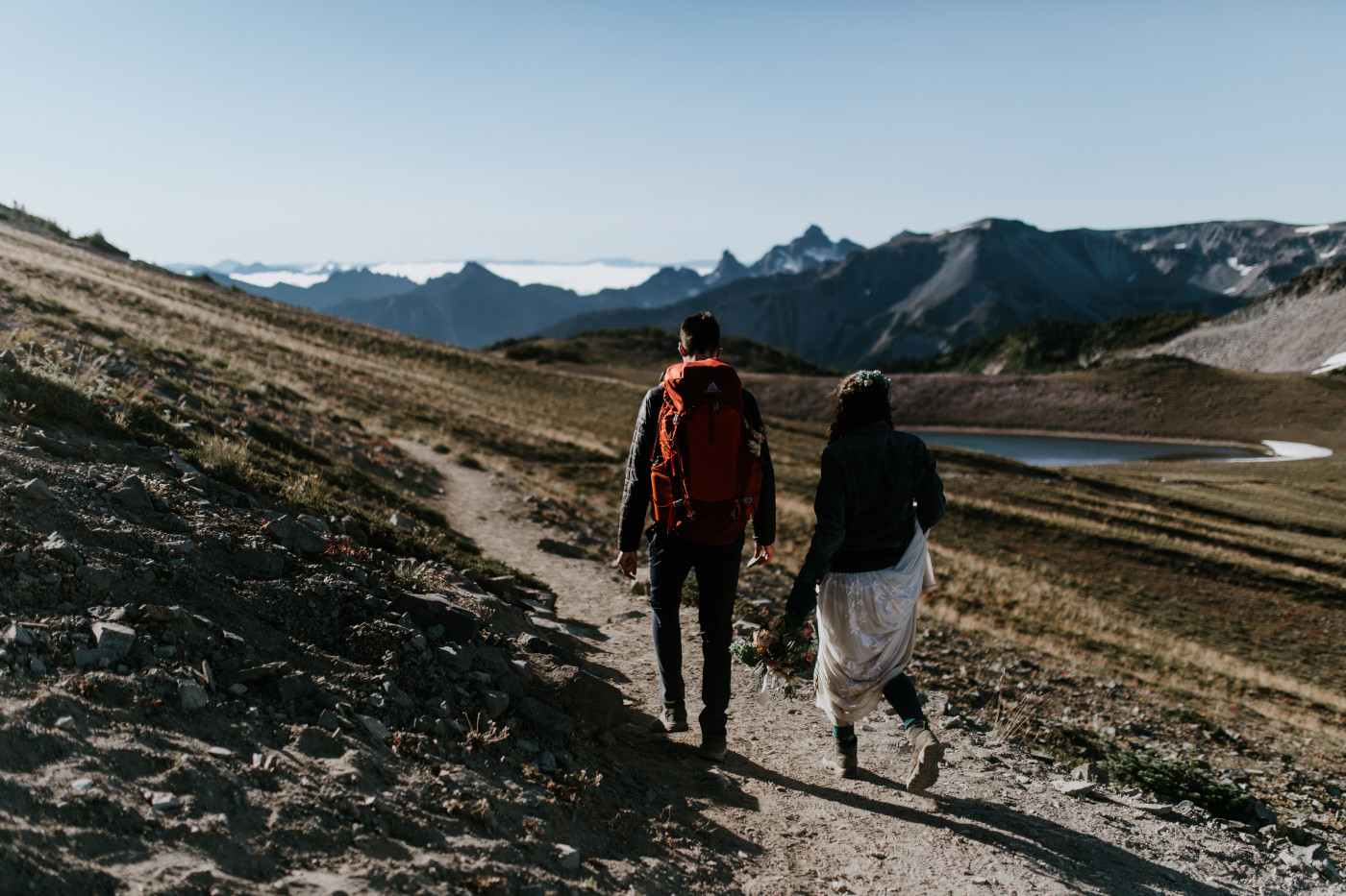 Tasha and Chad walk back down from the lookout. Elopement photography at Mount Rainier by Sienna Plus Josh.