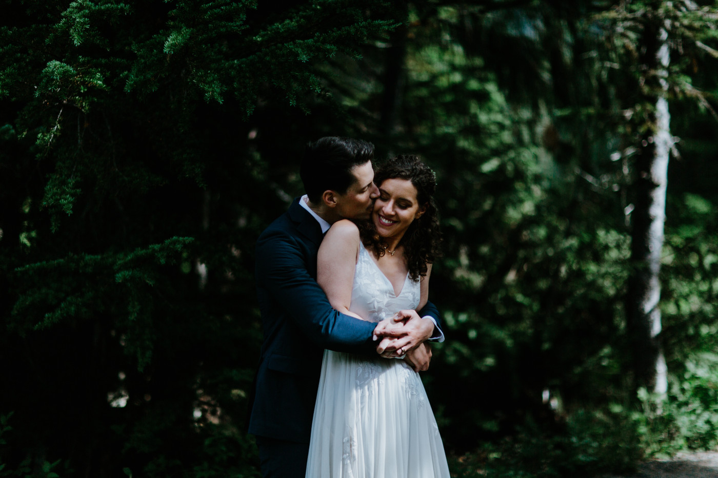 Tasha and Chad hug. Elopement photography at Mount Rainier by Sienna Plus Josh.