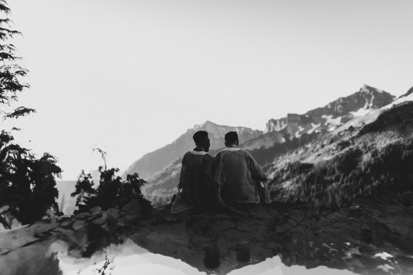 Brooks and Fred sit together looking at the view of Mount Rainier after their elopement.