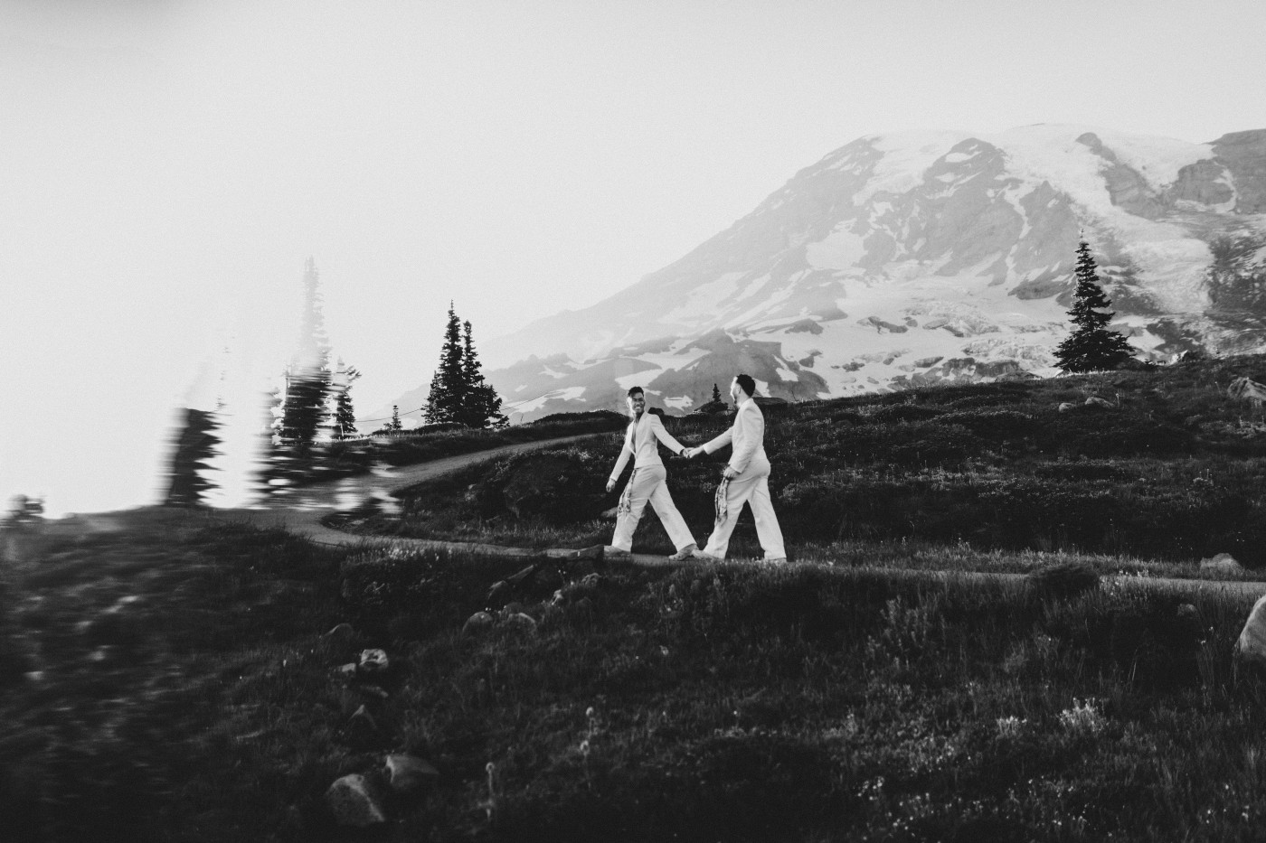 Fred and Brooks walk a trail at Mount Rainier.
