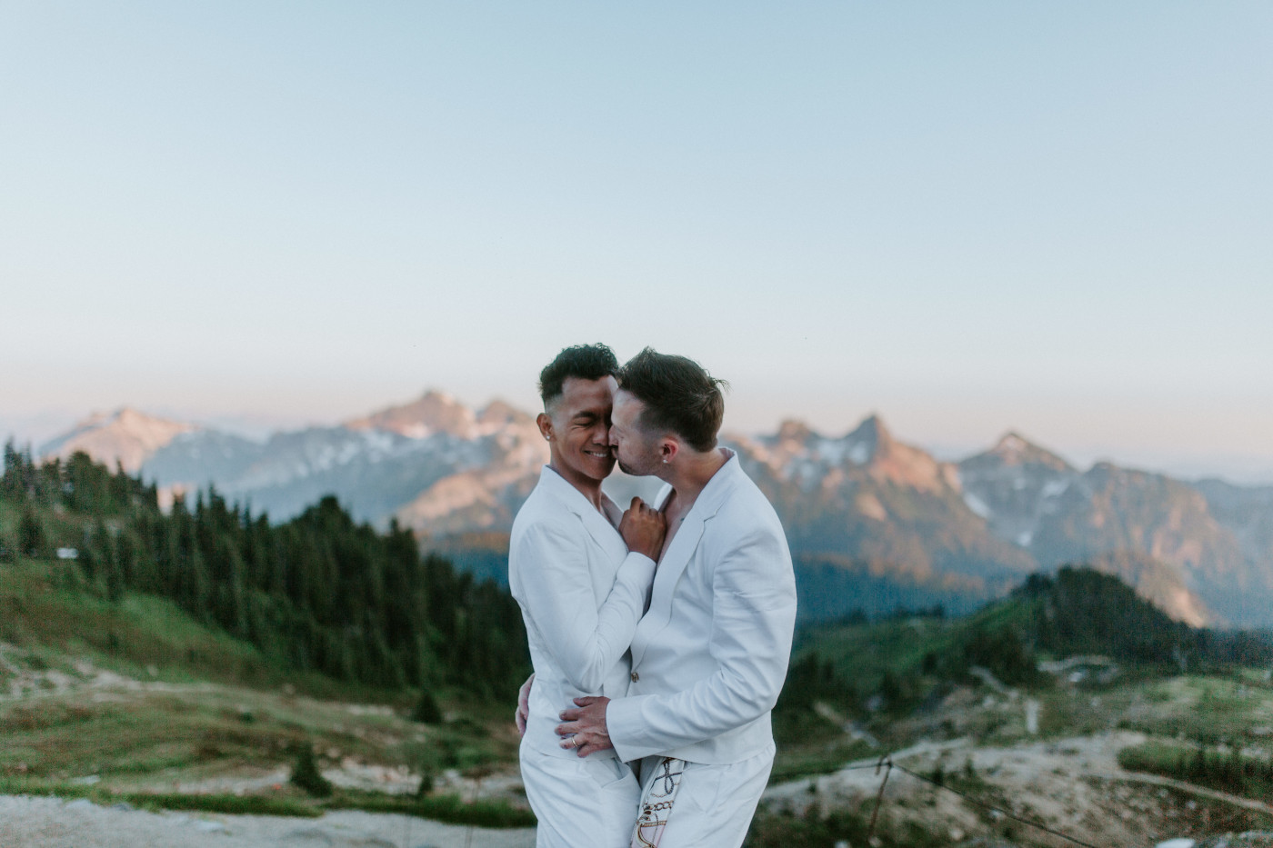 Brooks and Fred share a kiss at Mount Rainier.