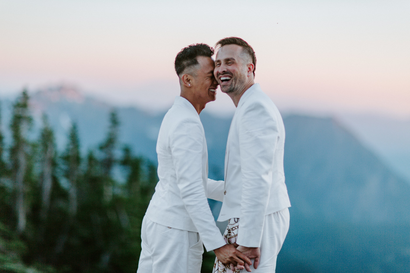 Fred and Brooks laughing after their elopement ceremony in Mount Rainier.