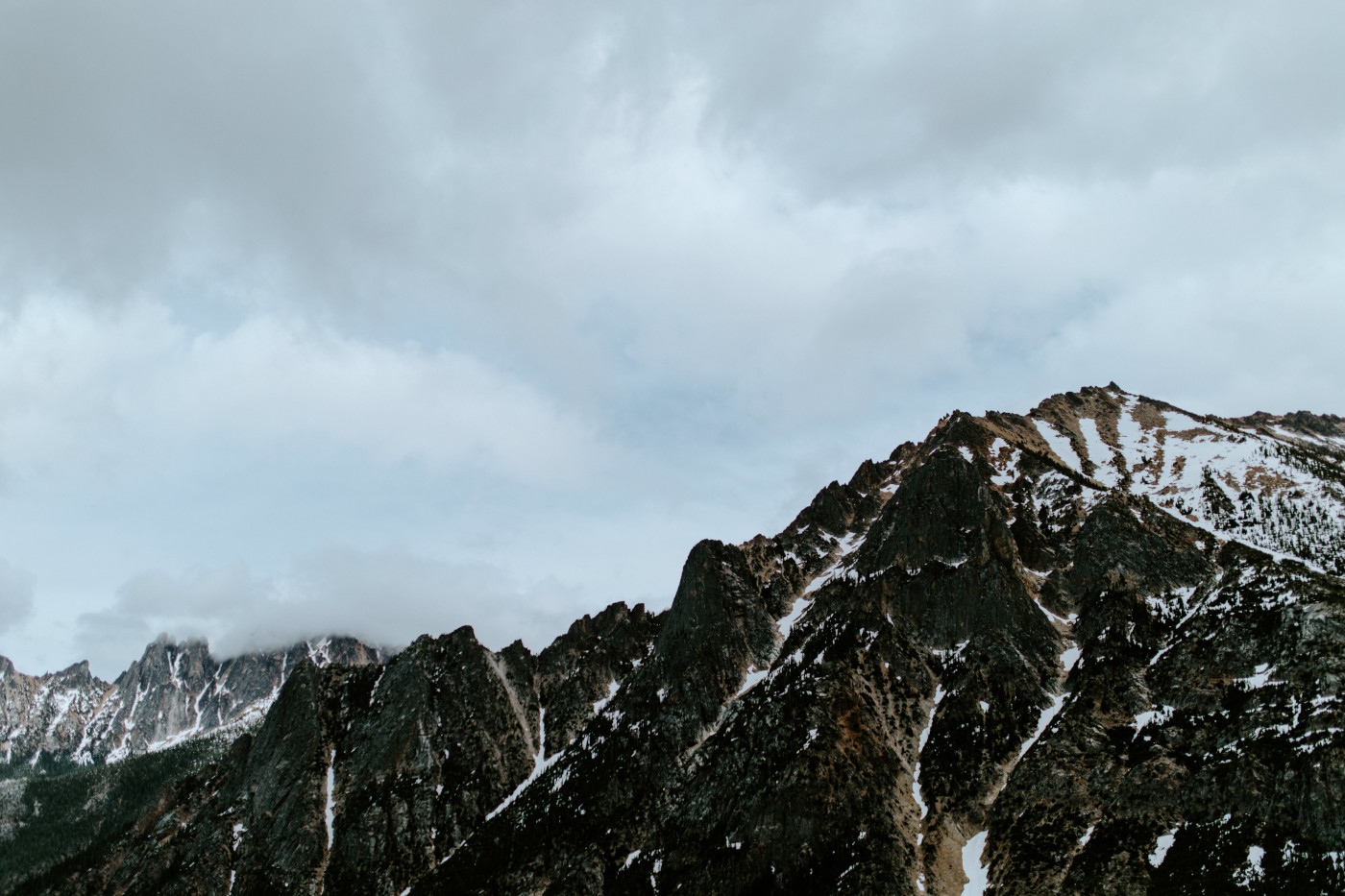 Elizabeth and Alex kiss. Elopement photography at North Cascades National Park by Sienna Plus Josh.