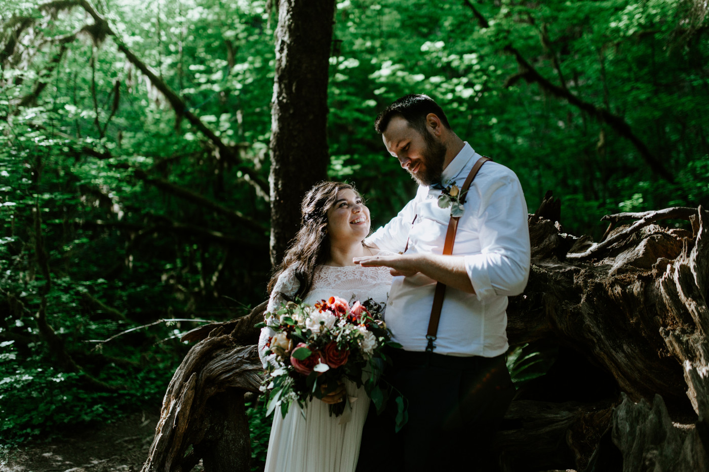 Jack admires his ring. Elopement photography at Olympic National Park by Sienna Plus Josh.